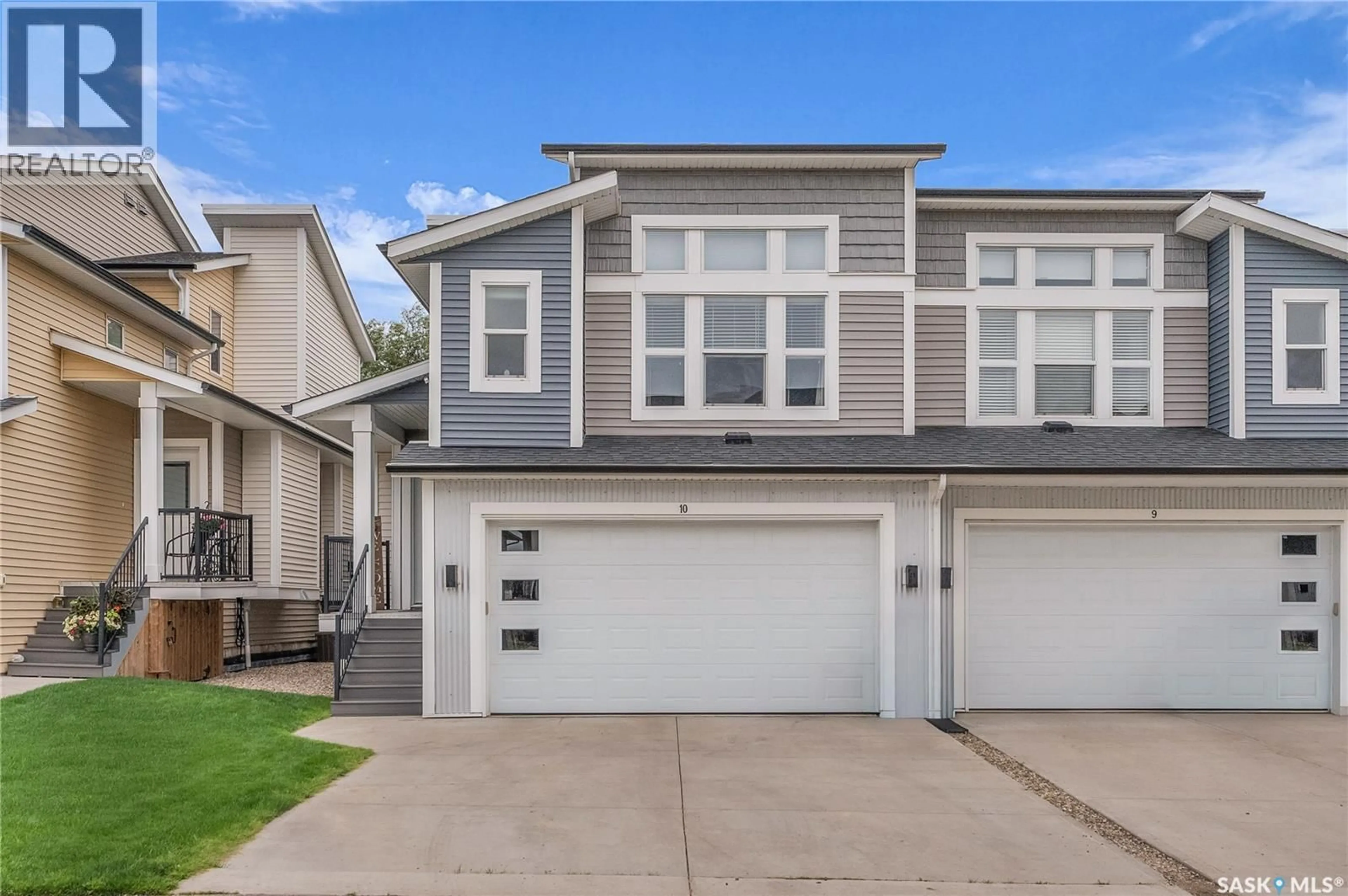 Home with vinyl exterior material, street for 10 700 CENTRAL STREET, Warman Saskatchewan S0K0A1