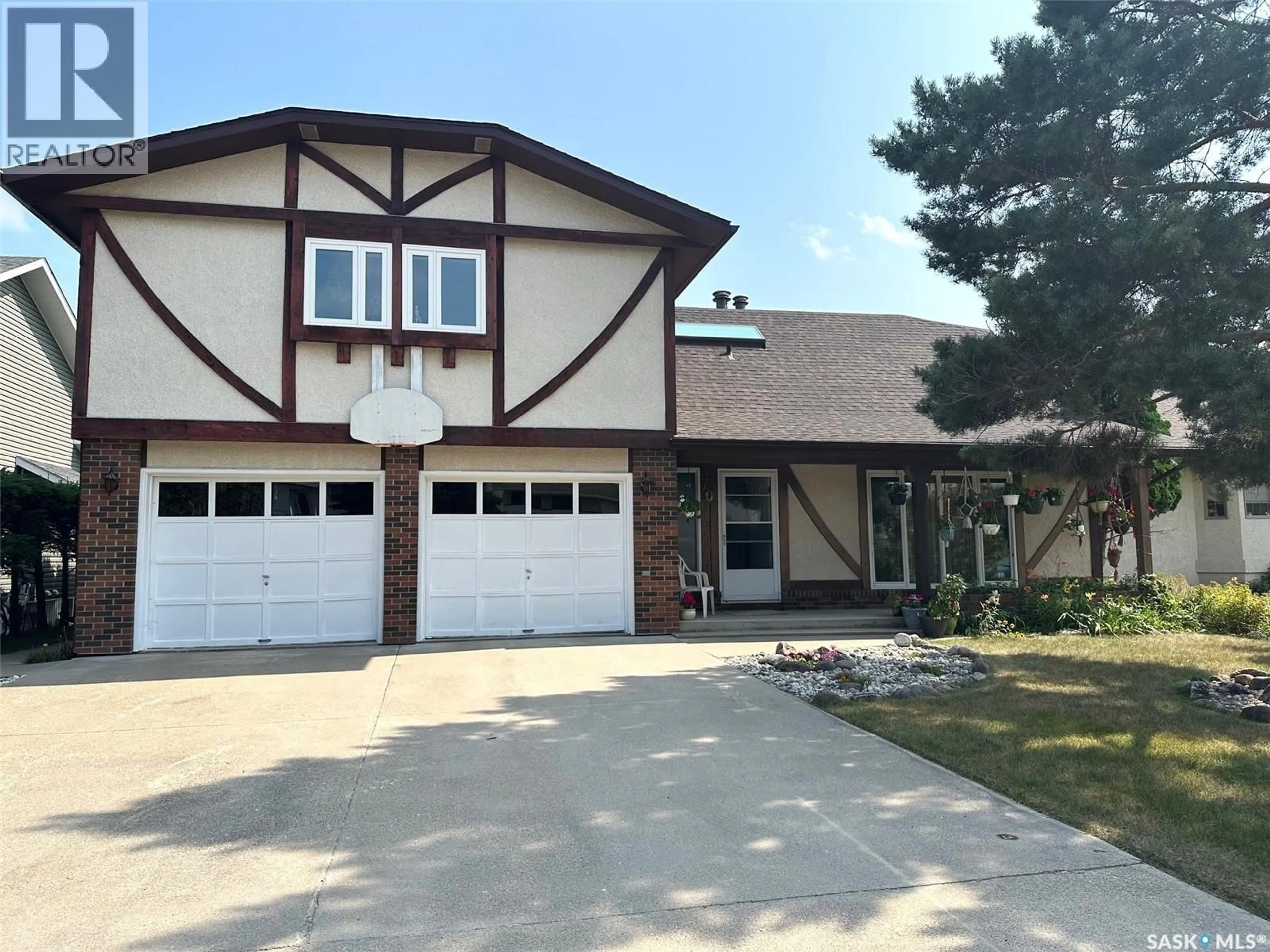 Home with vinyl exterior material, street for 706 DONALD STREET, Hudson Bay Saskatchewan S0E0Y0