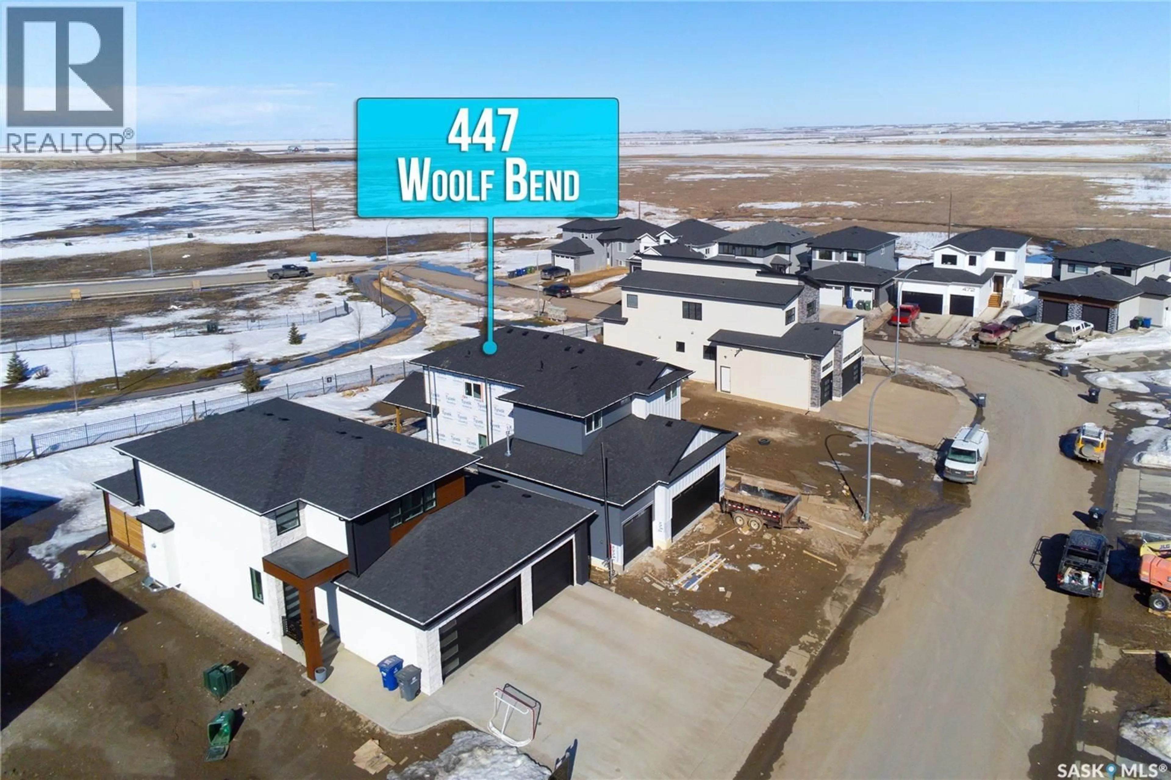 A pic from outside/outdoor area/front of a property/back of a property/a pic from drone, street for 447 WOOLF BEND, Saskatoon Saskatchewan S7W1E6