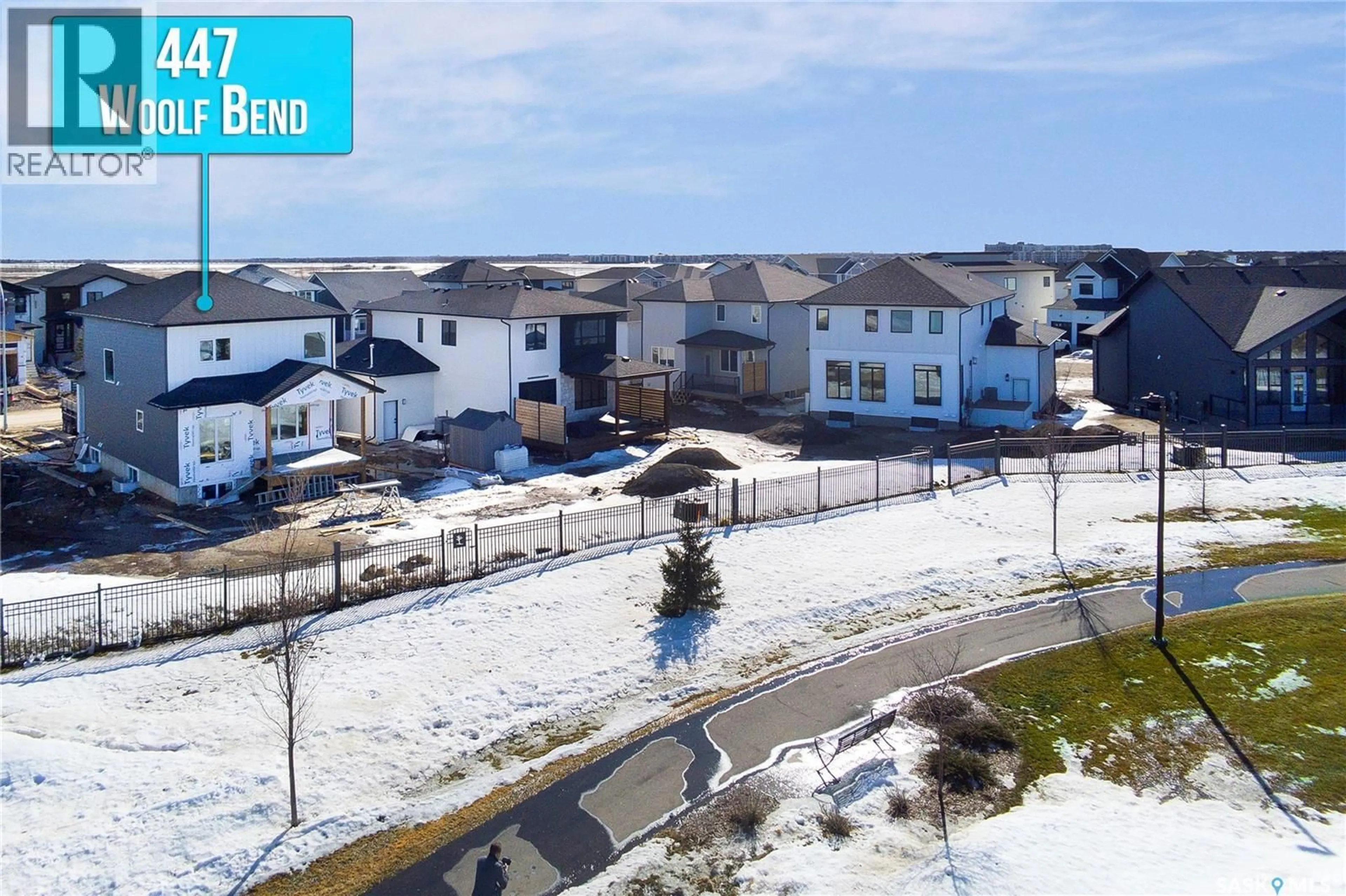 A pic from outside/outdoor area/front of a property/back of a property/a pic from drone, street for 447 WOOLF BEND, Saskatoon Saskatchewan S7W1E6