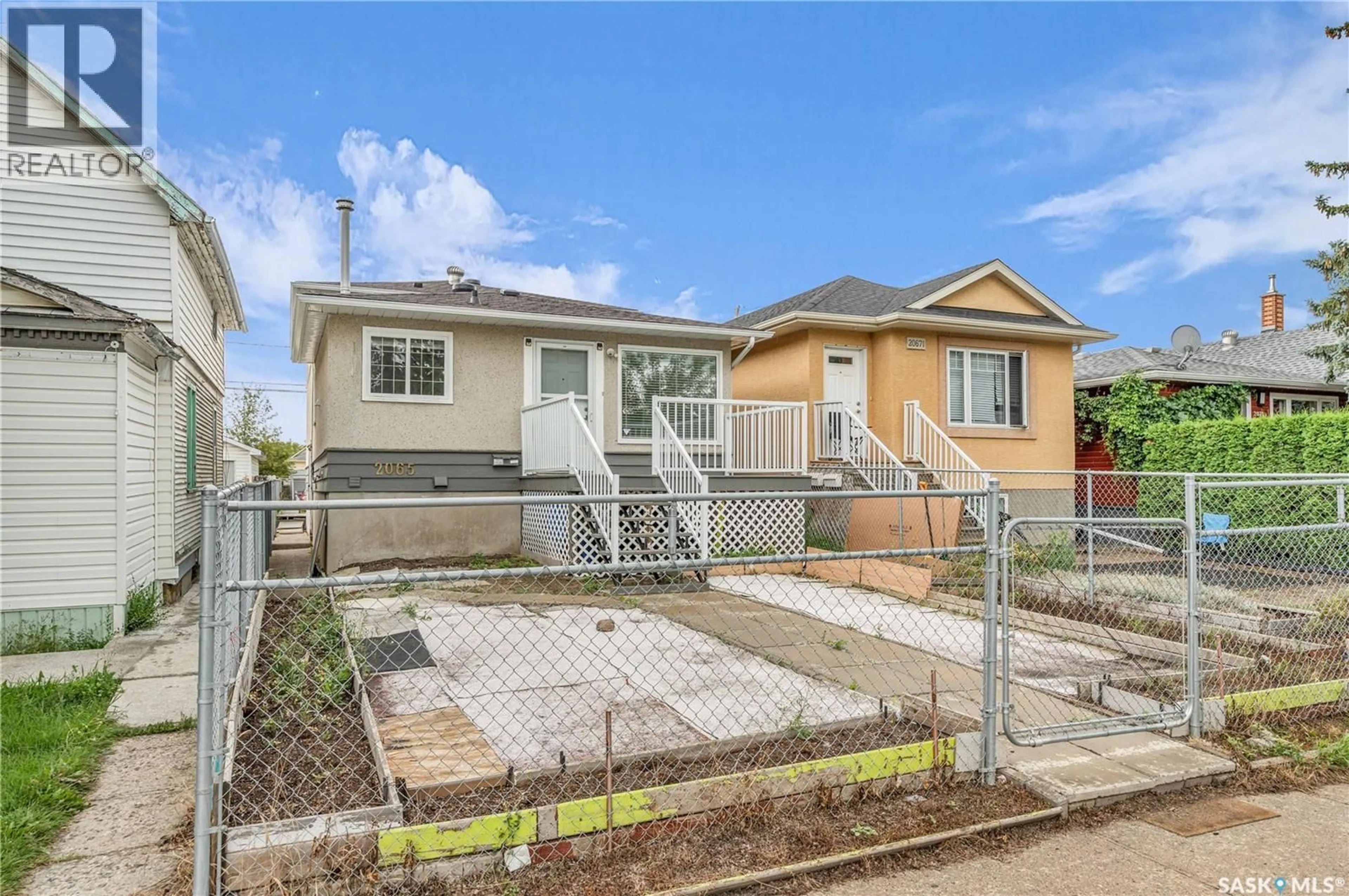 Home with vinyl exterior material, street for 2065 BRODER STREET, Regina Saskatchewan S4N3S3