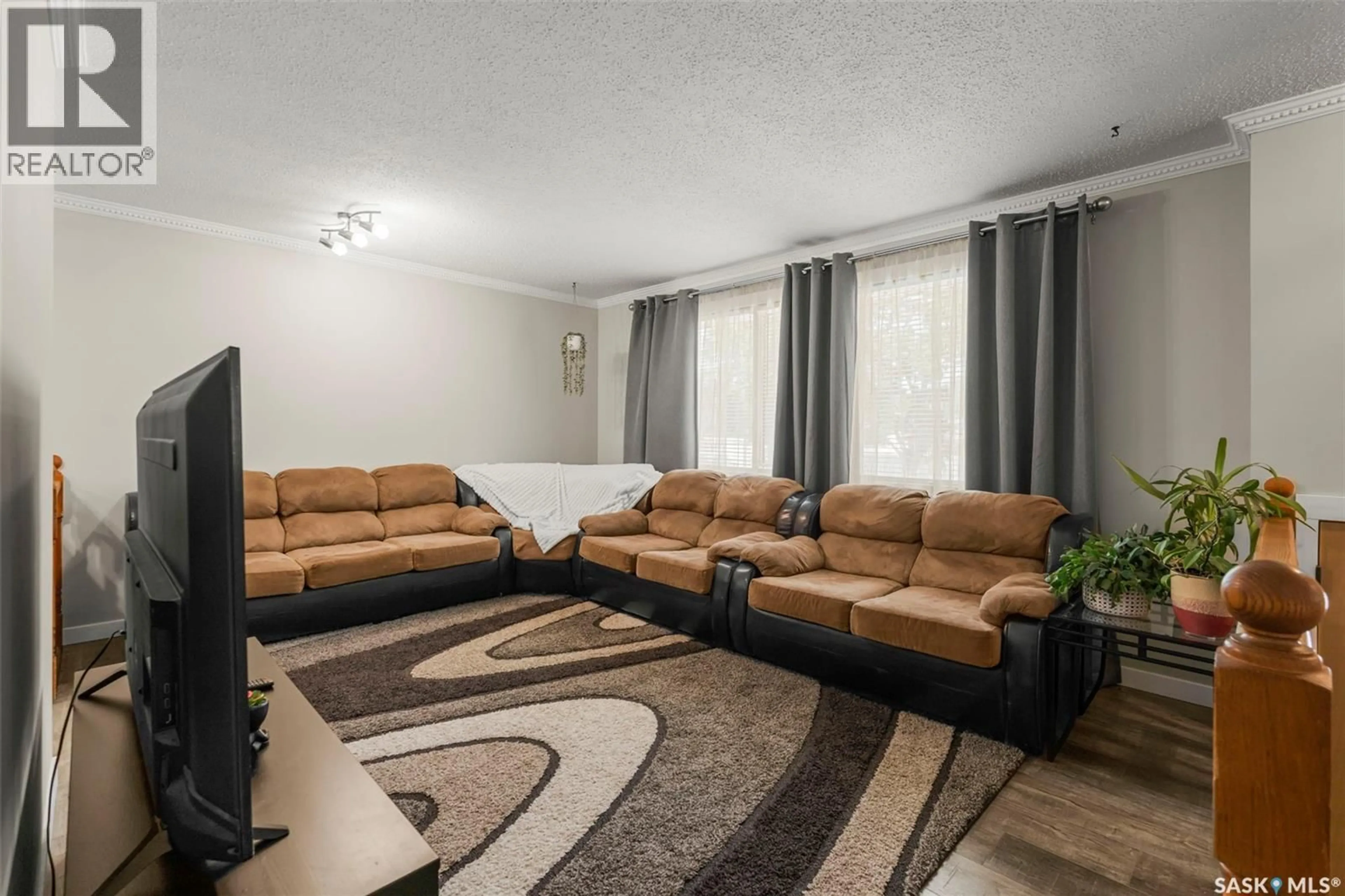 Living room with furniture, carpet floor for 3238 MASSEY DRIVE, Saskatoon Saskatchewan S7L4M9