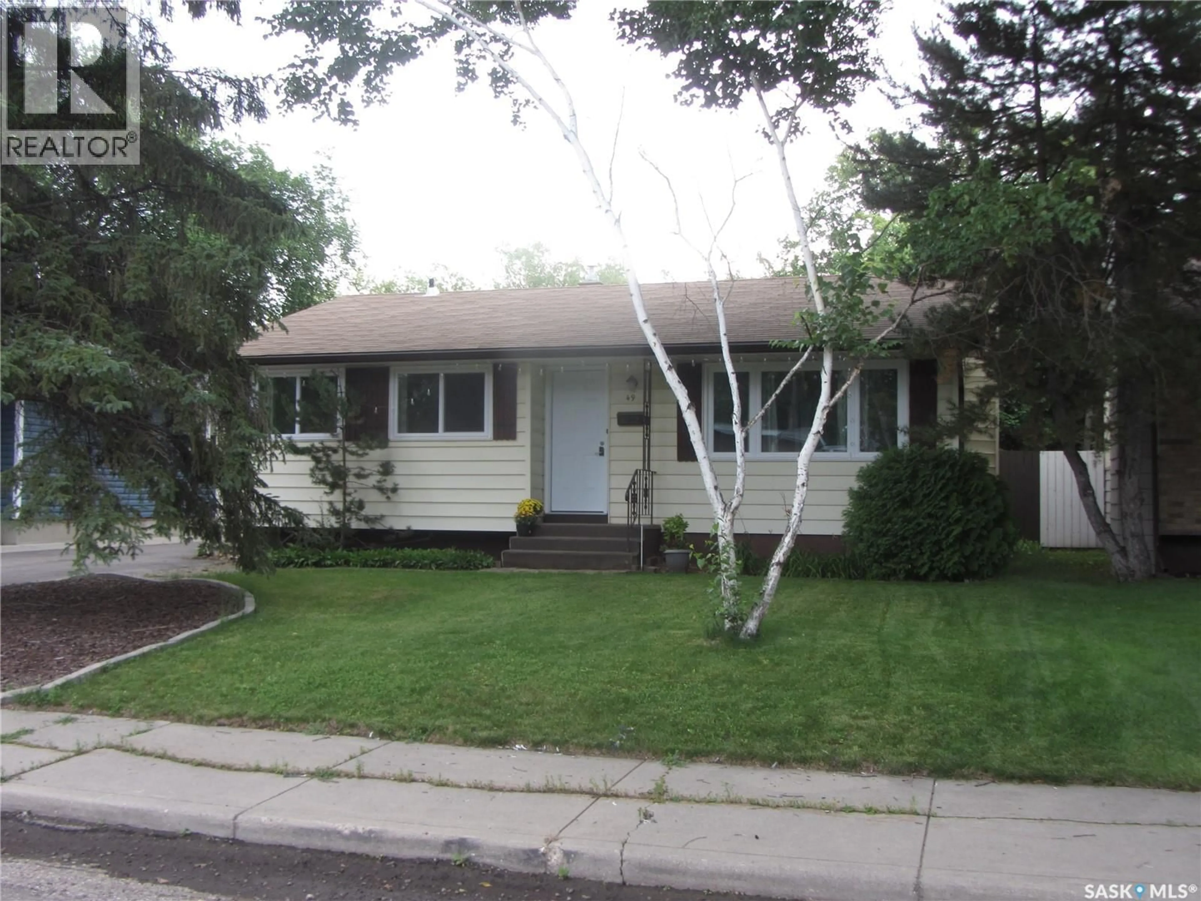 Home with vinyl exterior material, street for 49 MCLELLAN AVENUE, Saskatoon Saskatchewan S7H3K7