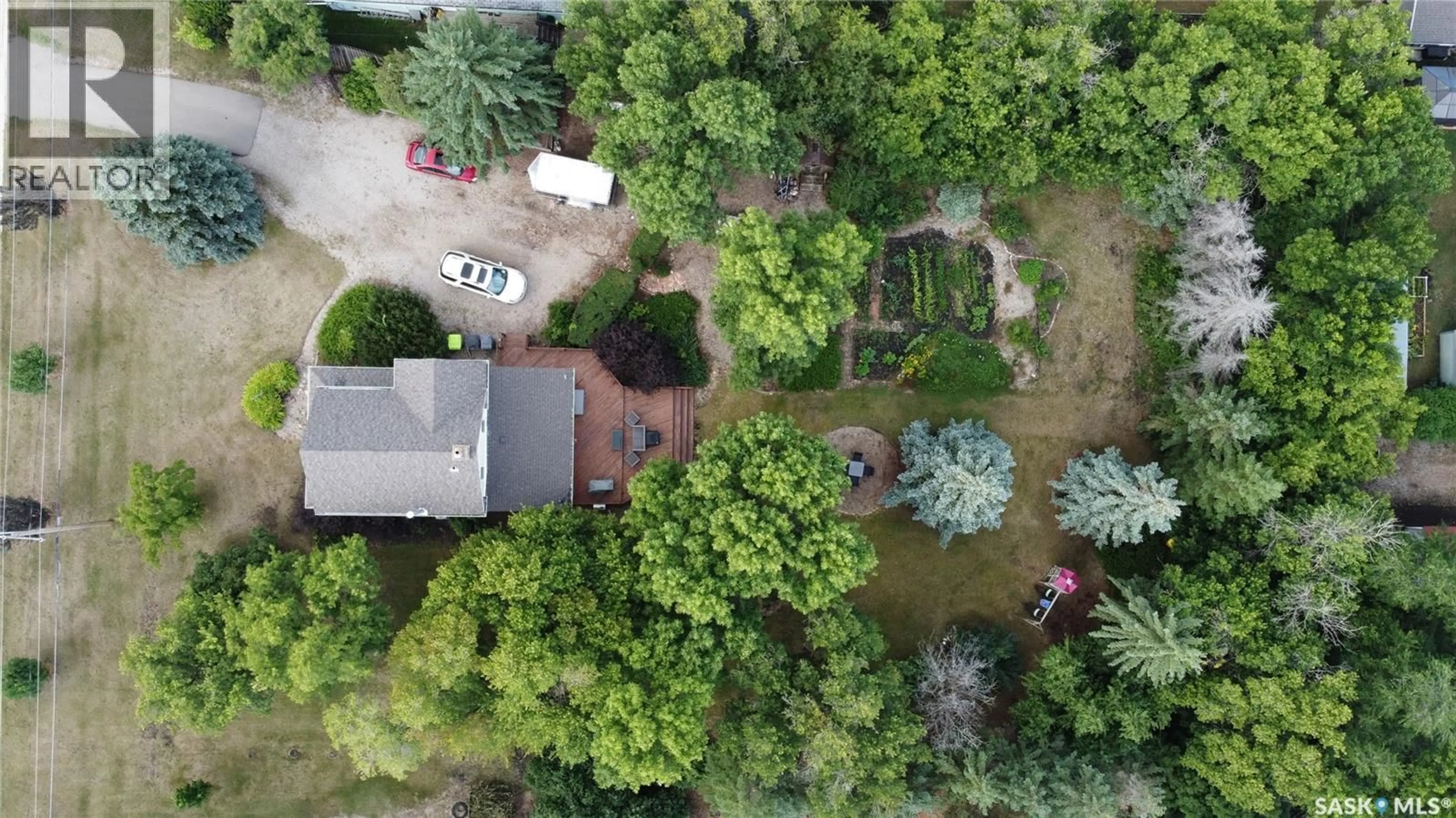 A pic from outside/outdoor area/front of a property/back of a property/a pic from drone, forest/trees view for 1005 WOODWARD AVENUE, Indian Head Saskatchewan S0G2K0