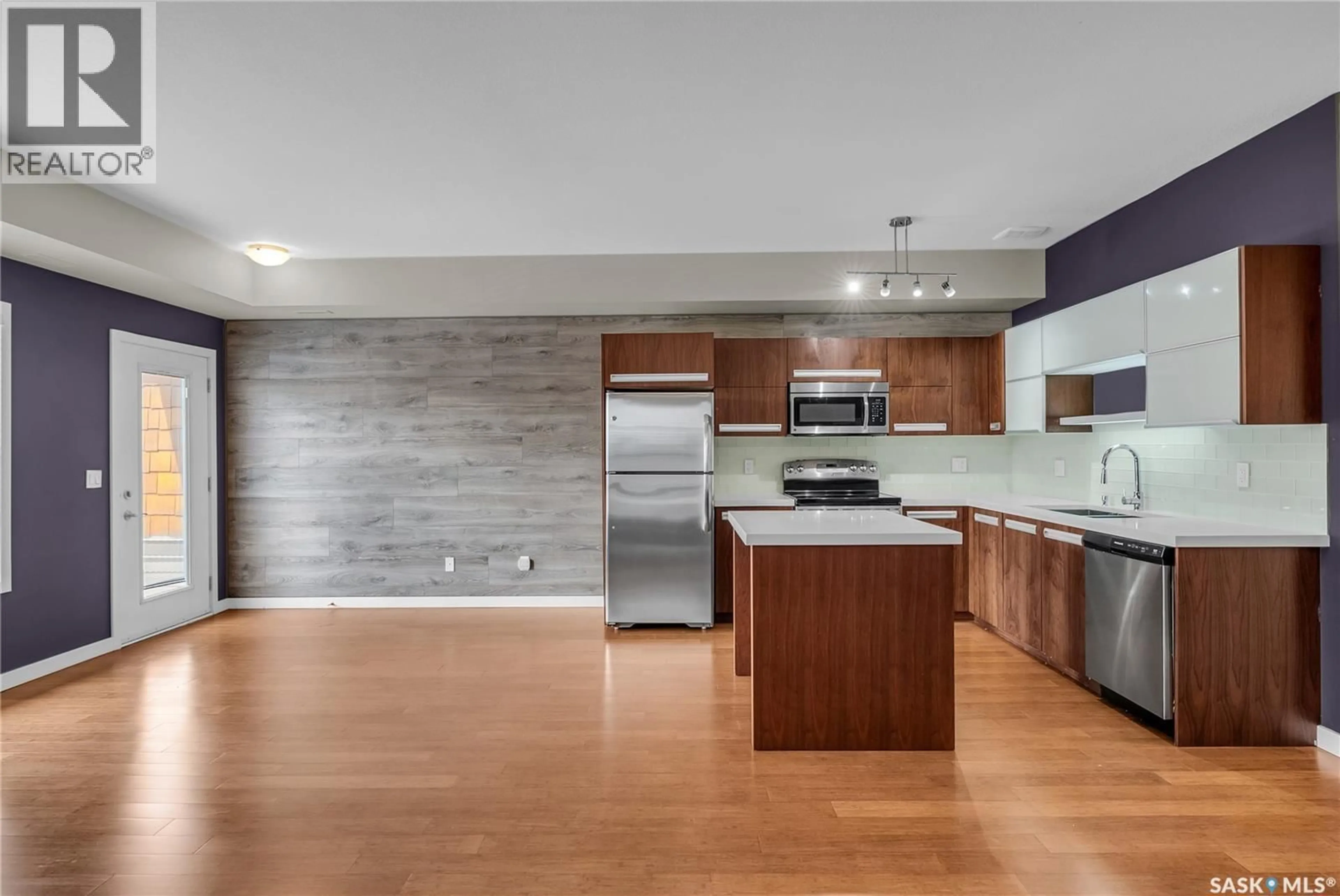 Open concept kitchen, wood/laminate floor for 1015 - 2508 PATRICK CRESCENT, Saskatoon Saskatchewan S7W0M1