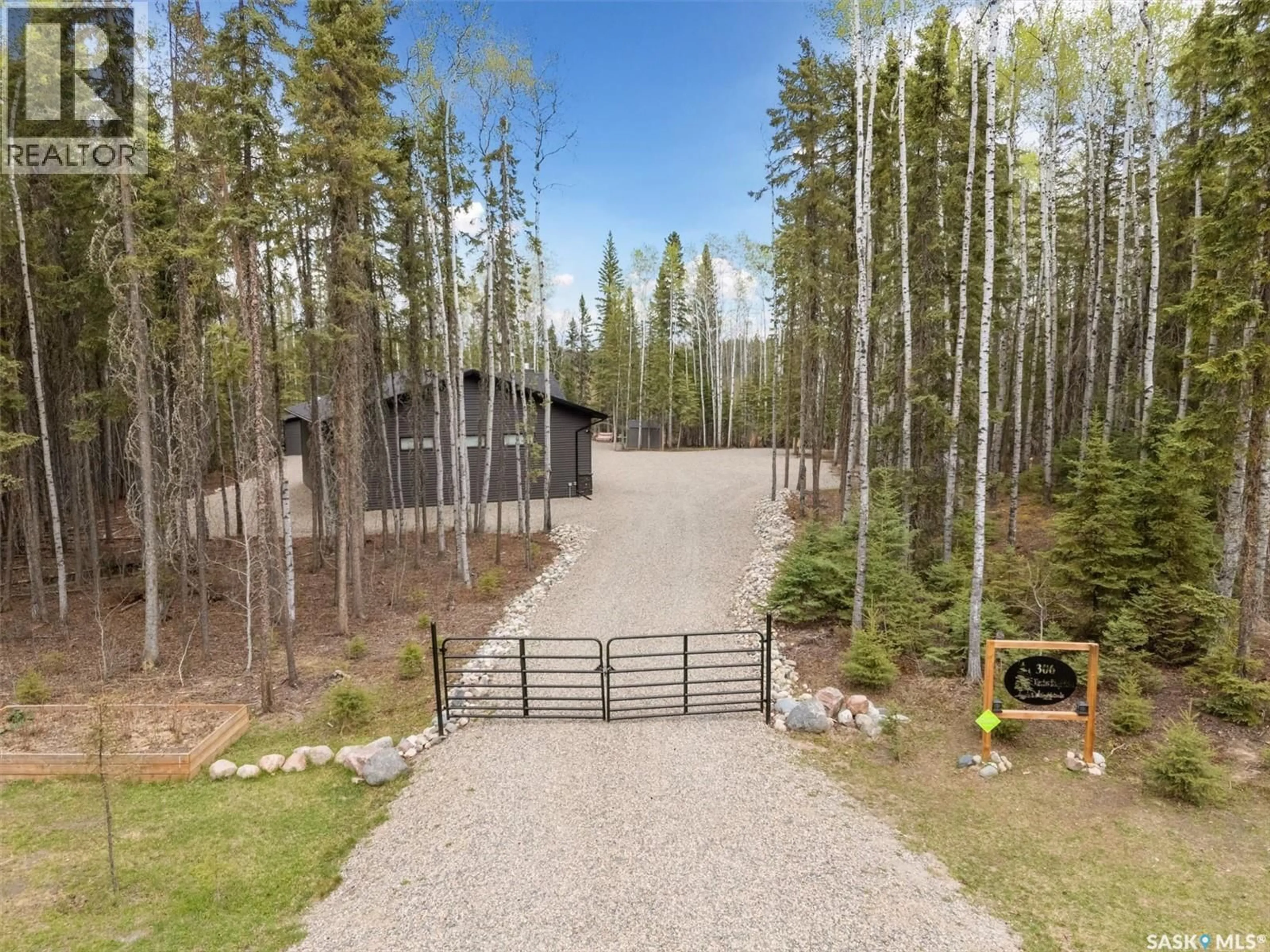 A pic from outside/outdoor area/front of a property/back of a property/a pic from drone, forest/trees view for 306 MEADOW RIDGE DRIVE, Candle Lake Saskatchewan S0J3E0