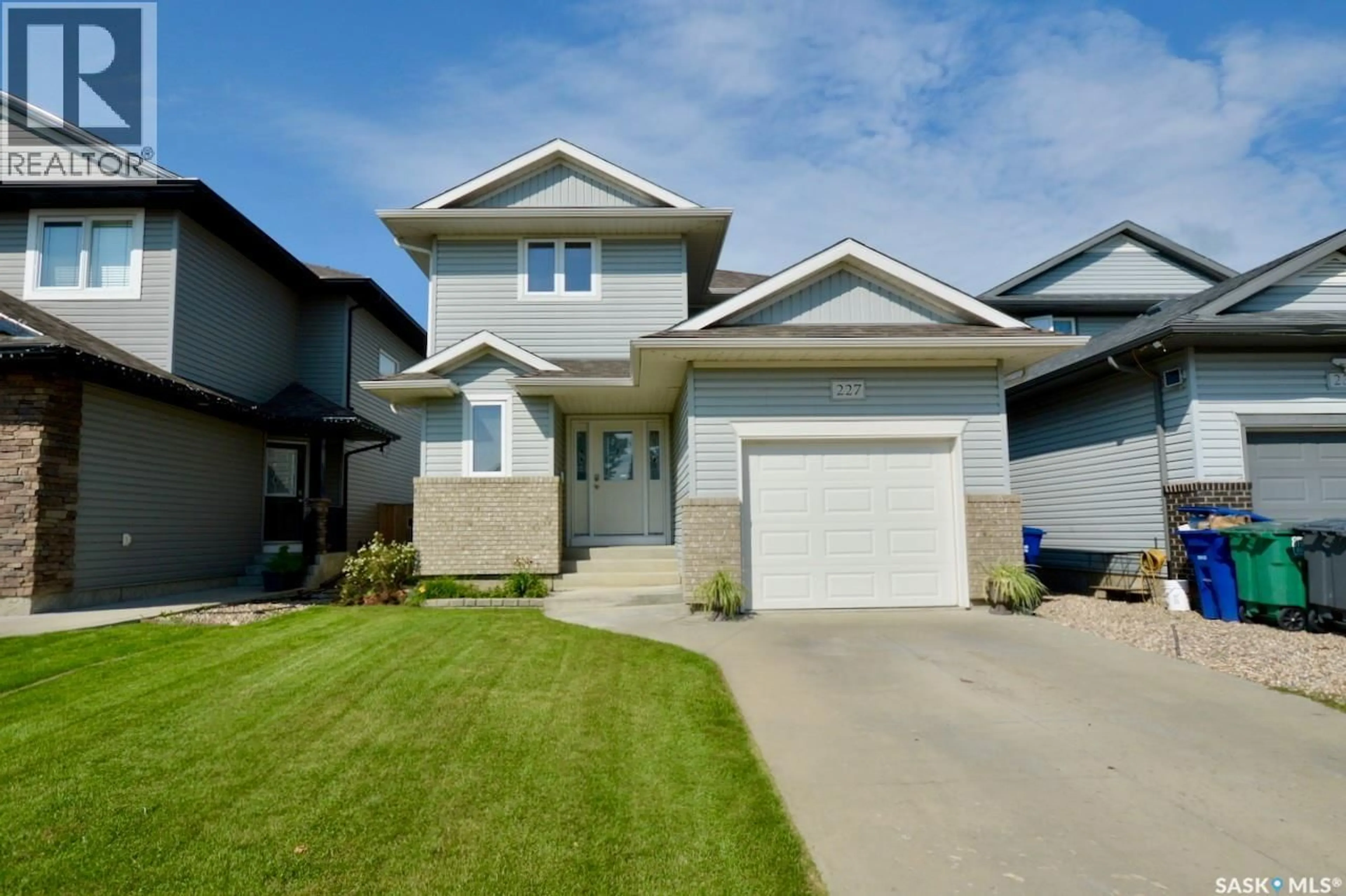 Home with vinyl exterior material, street for 227 KOROL CRESCENT, Saskatoon Saskatchewan S7R0E3