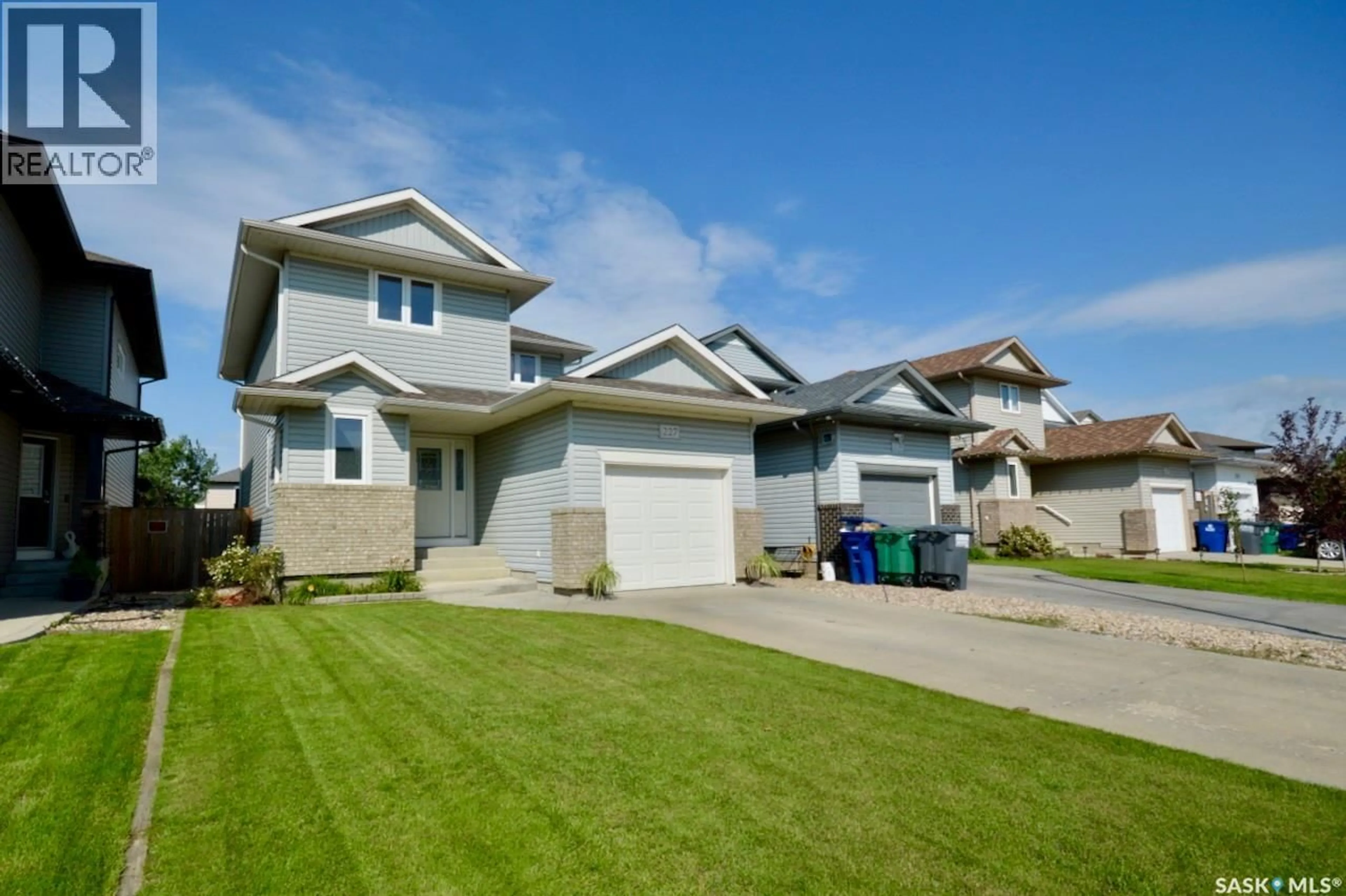 Home with vinyl exterior material, street for 227 KOROL CRESCENT, Saskatoon Saskatchewan S7R0E3