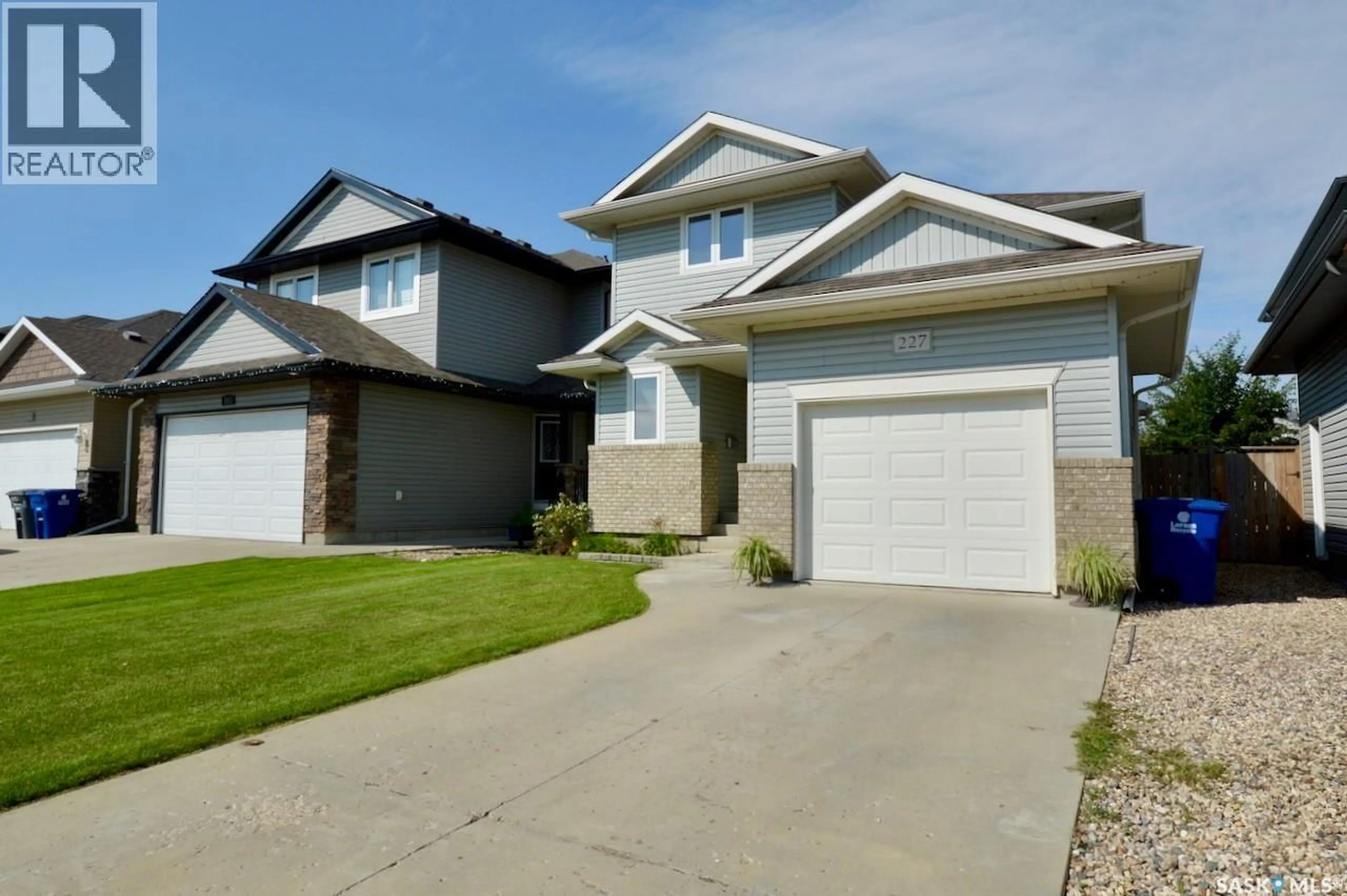 Home with vinyl exterior material, street for 227 KOROL CRESCENT, Saskatoon Saskatchewan S7R0E3