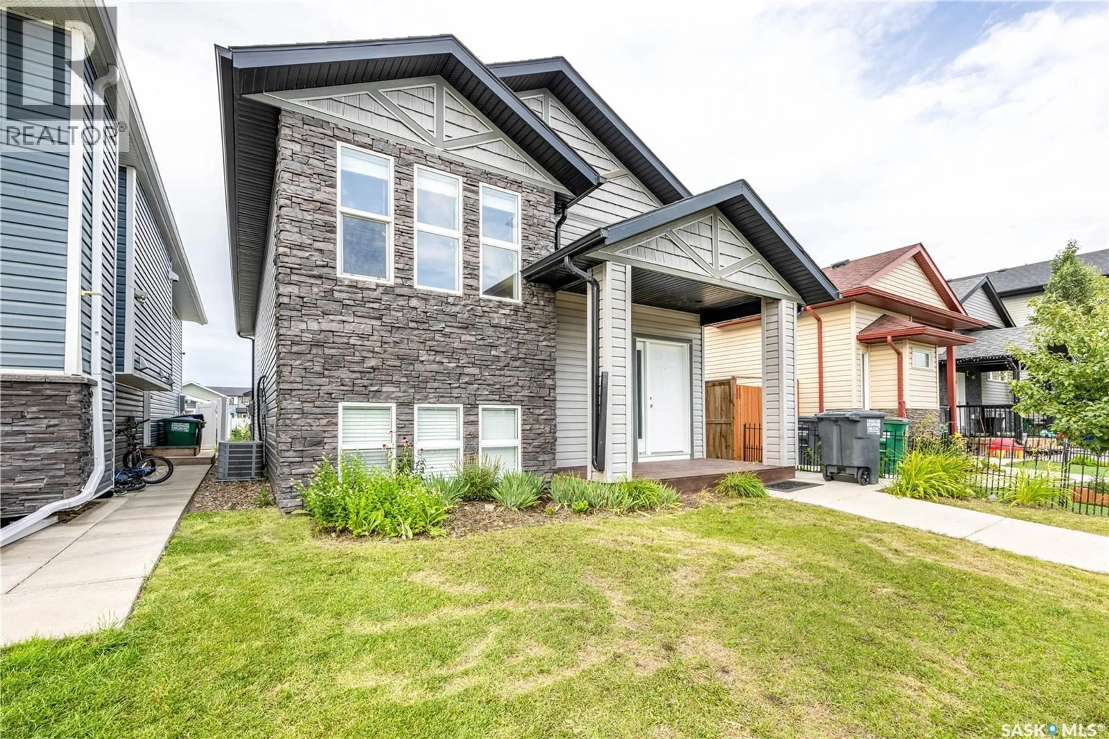 Home with brick exterior material, street for 550 MARLATTE LANE, Saskatoon Saskatchewan S7W0S8