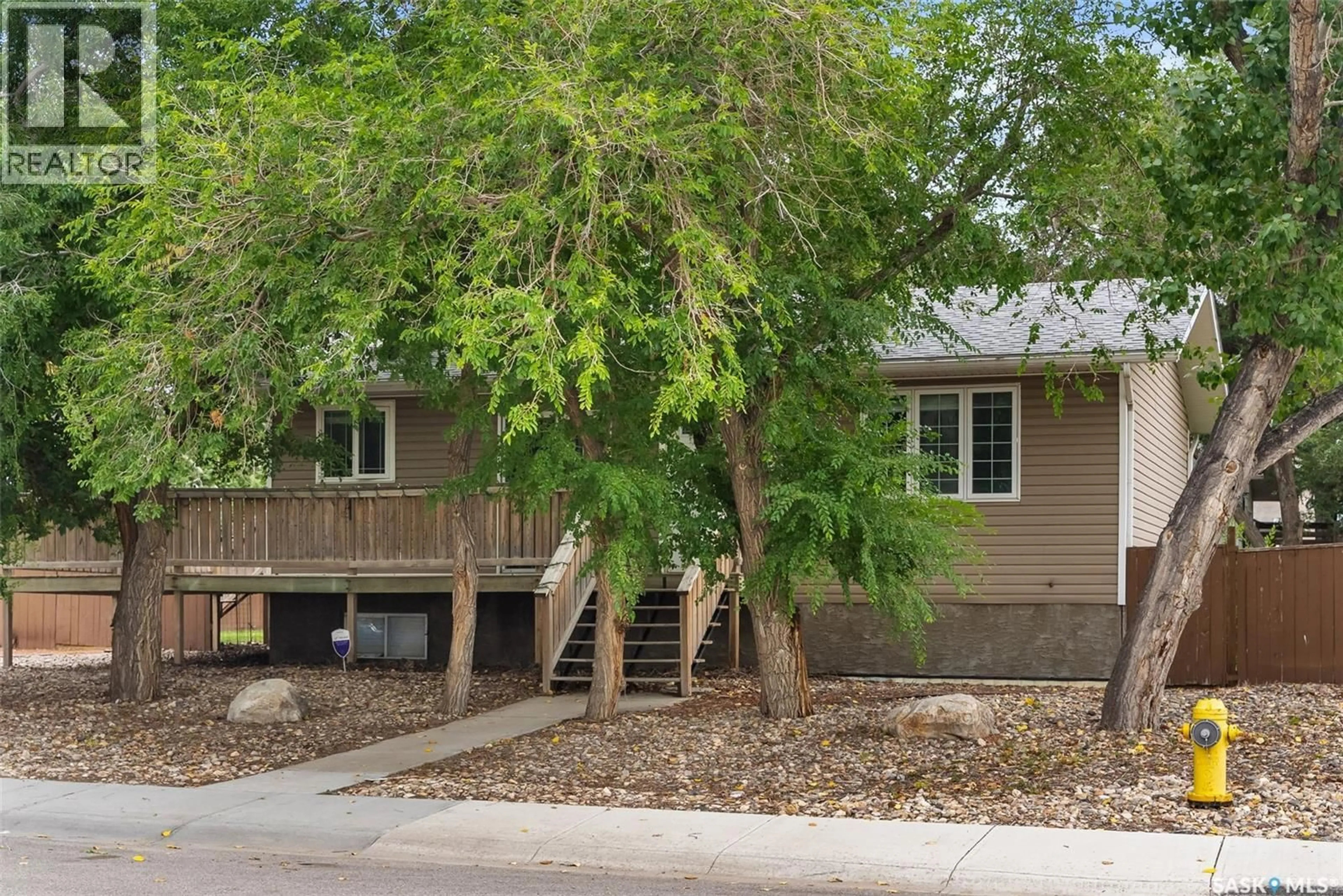 Home with vinyl exterior material, street for 6238 DEWDNEY AVENUE, Regina Saskatchewan S4T1E2