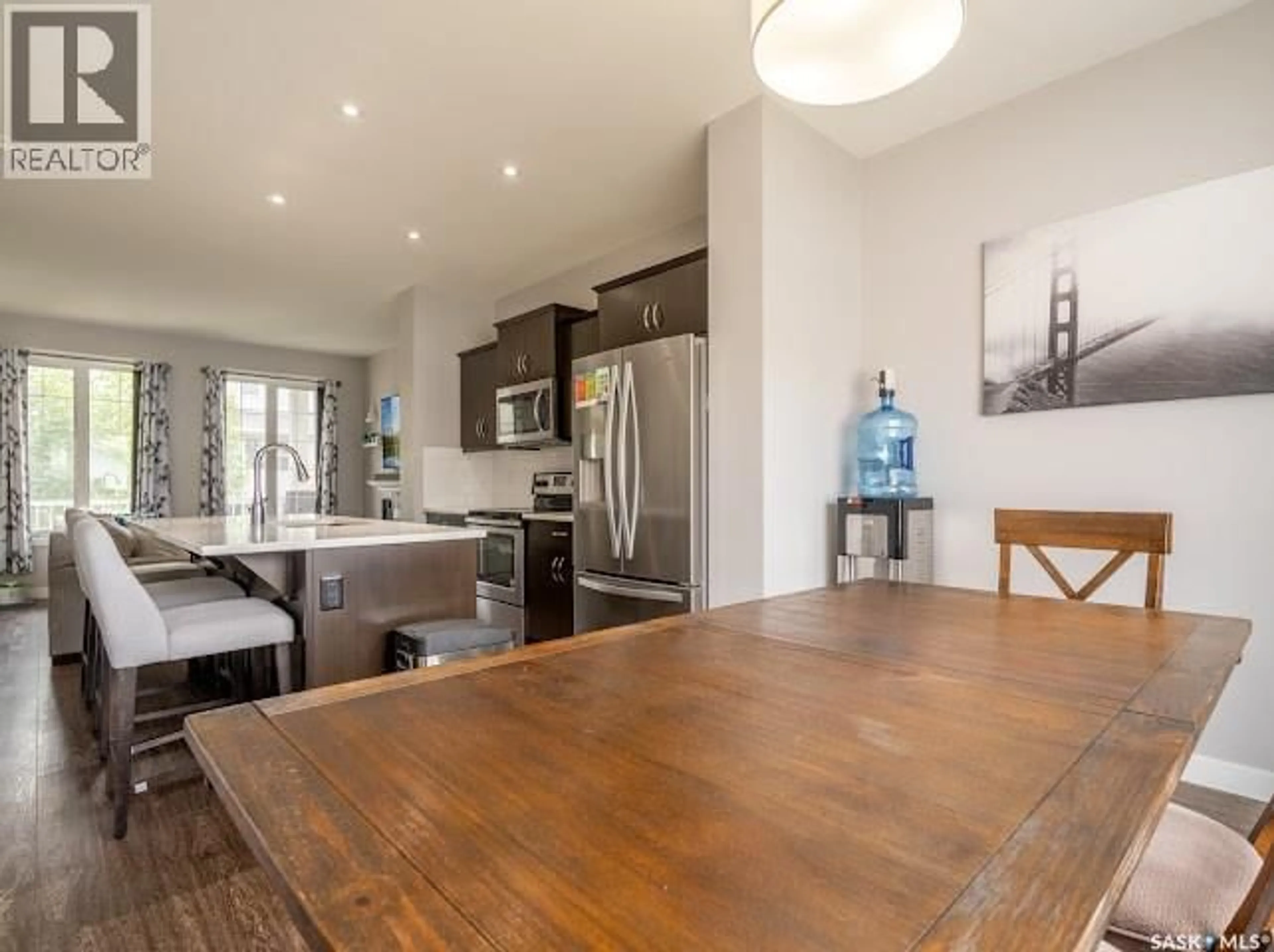 Open concept kitchen, wood/laminate floor for 5666 MCCAUGHEY STREET, Regina Saskatchewan S4W0P5