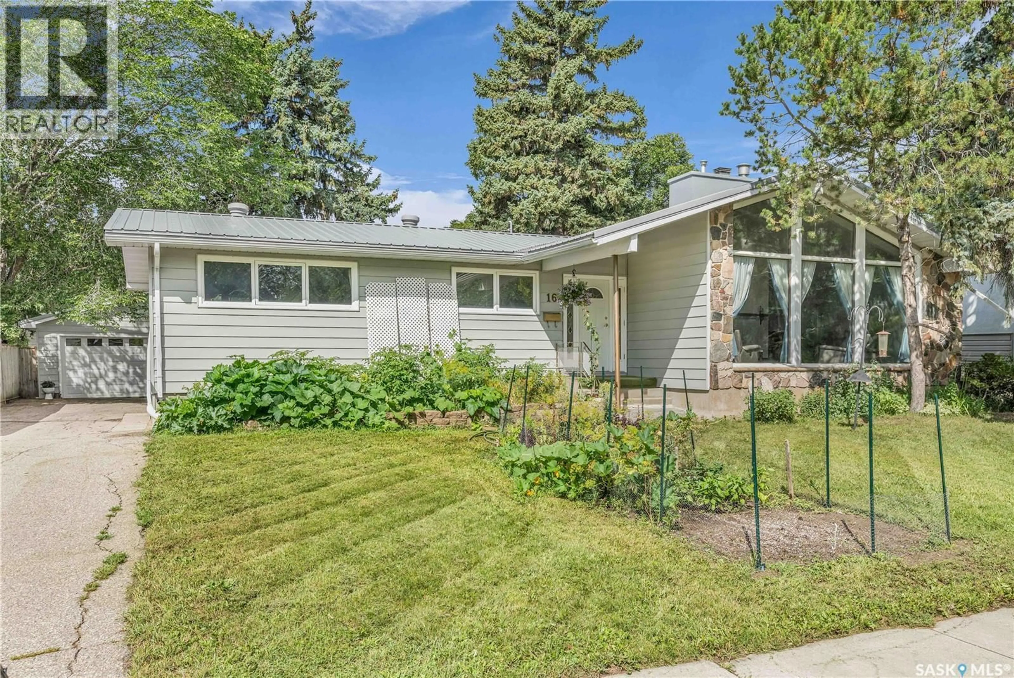 Home with vinyl exterior material, street for 16 MASSEY ROAD, Regina Saskatchewan S4S4M7