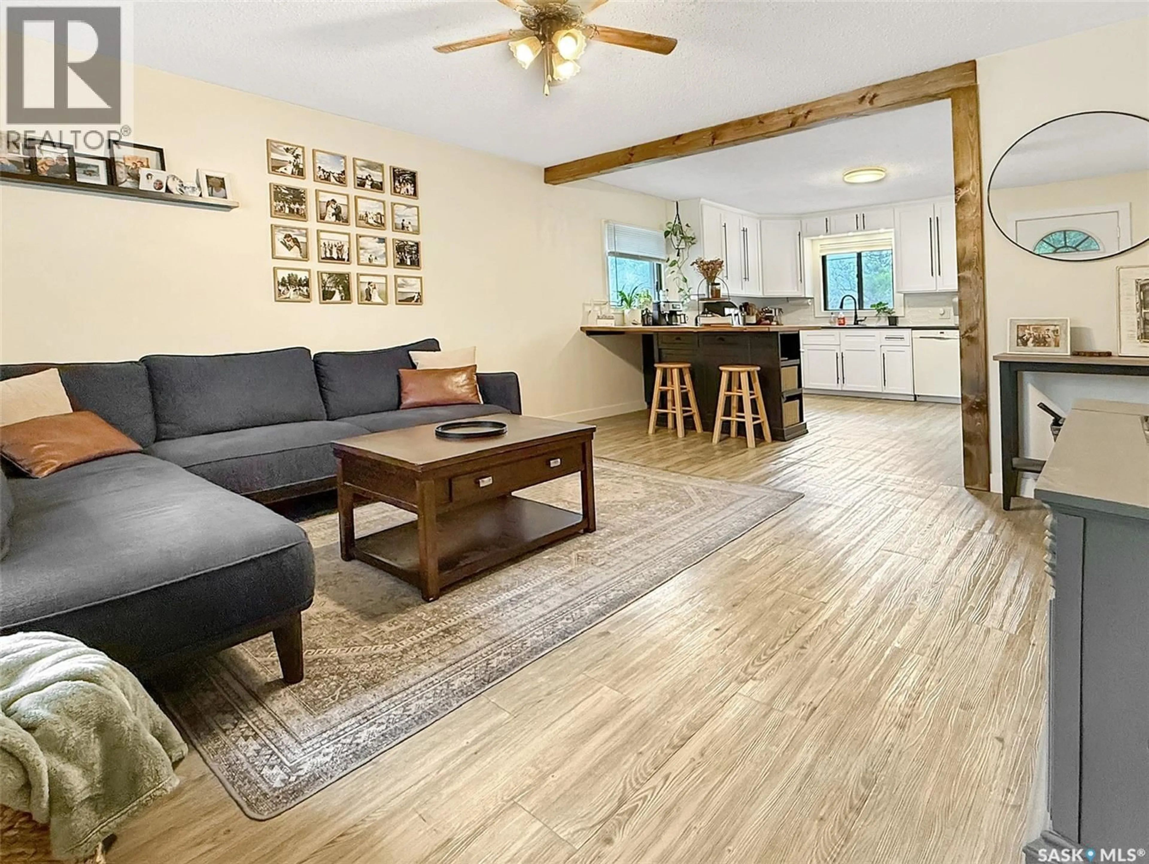Living room with furniture, wood/laminate floor for 368 9TH AVENUE, Swift Current Saskatchewan S9H1A9