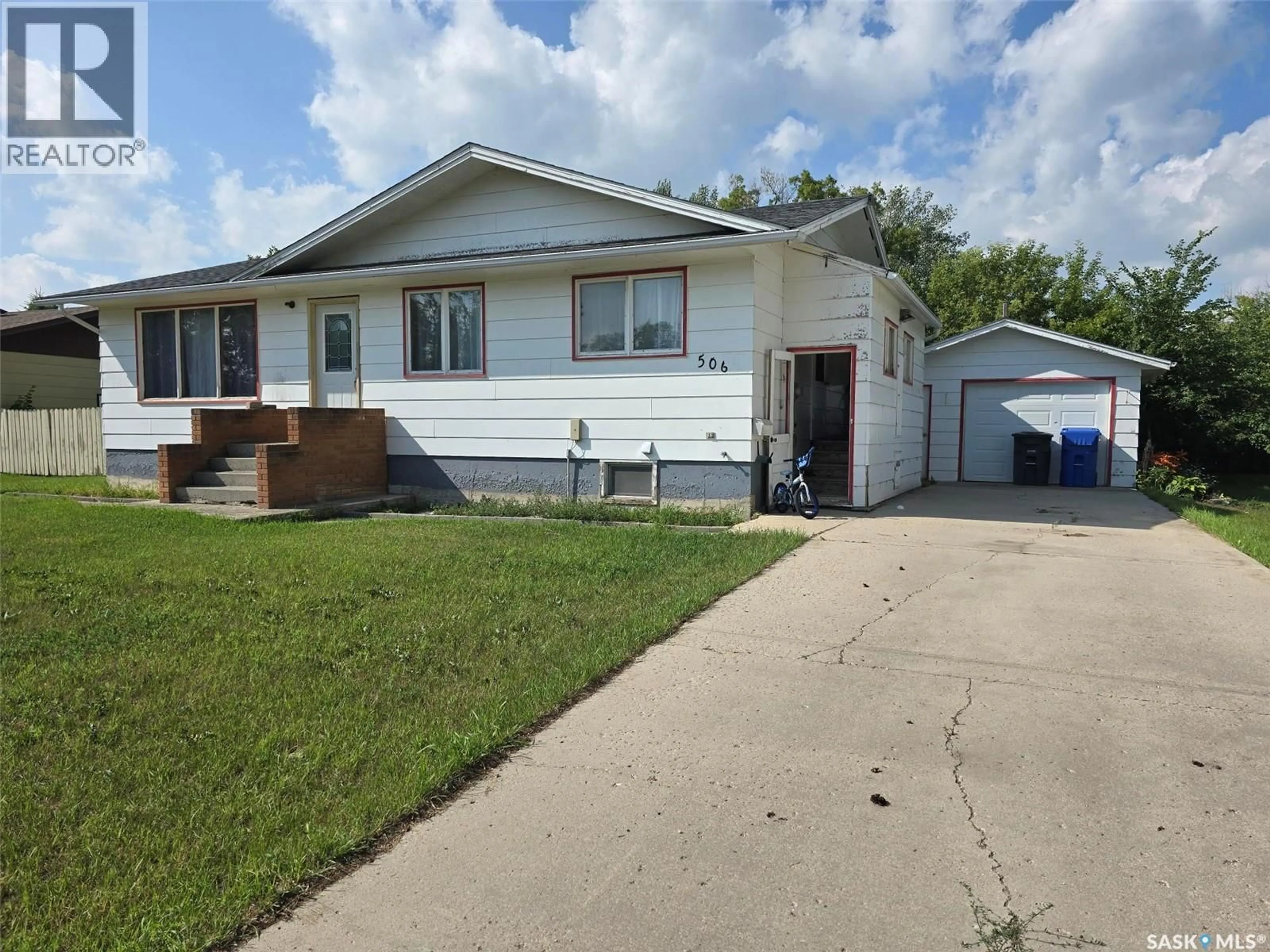 Home with vinyl exterior material, street for 506 WATER STREET, Wolseley Saskatchewan S0G5H0