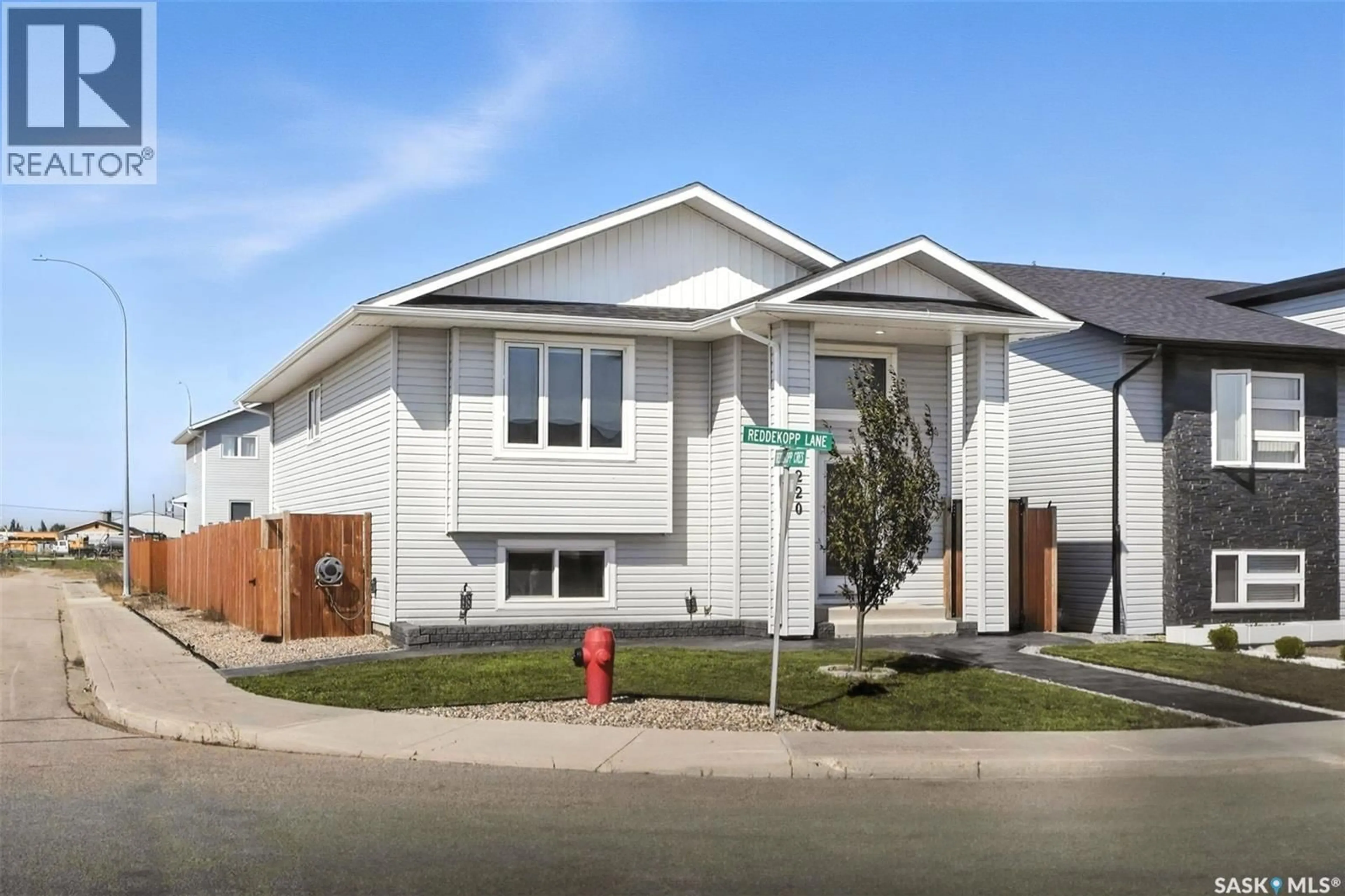 Home with vinyl exterior material, street for 220 REDDEKOPP LANE, Warman Saskatchewan S0K4S3