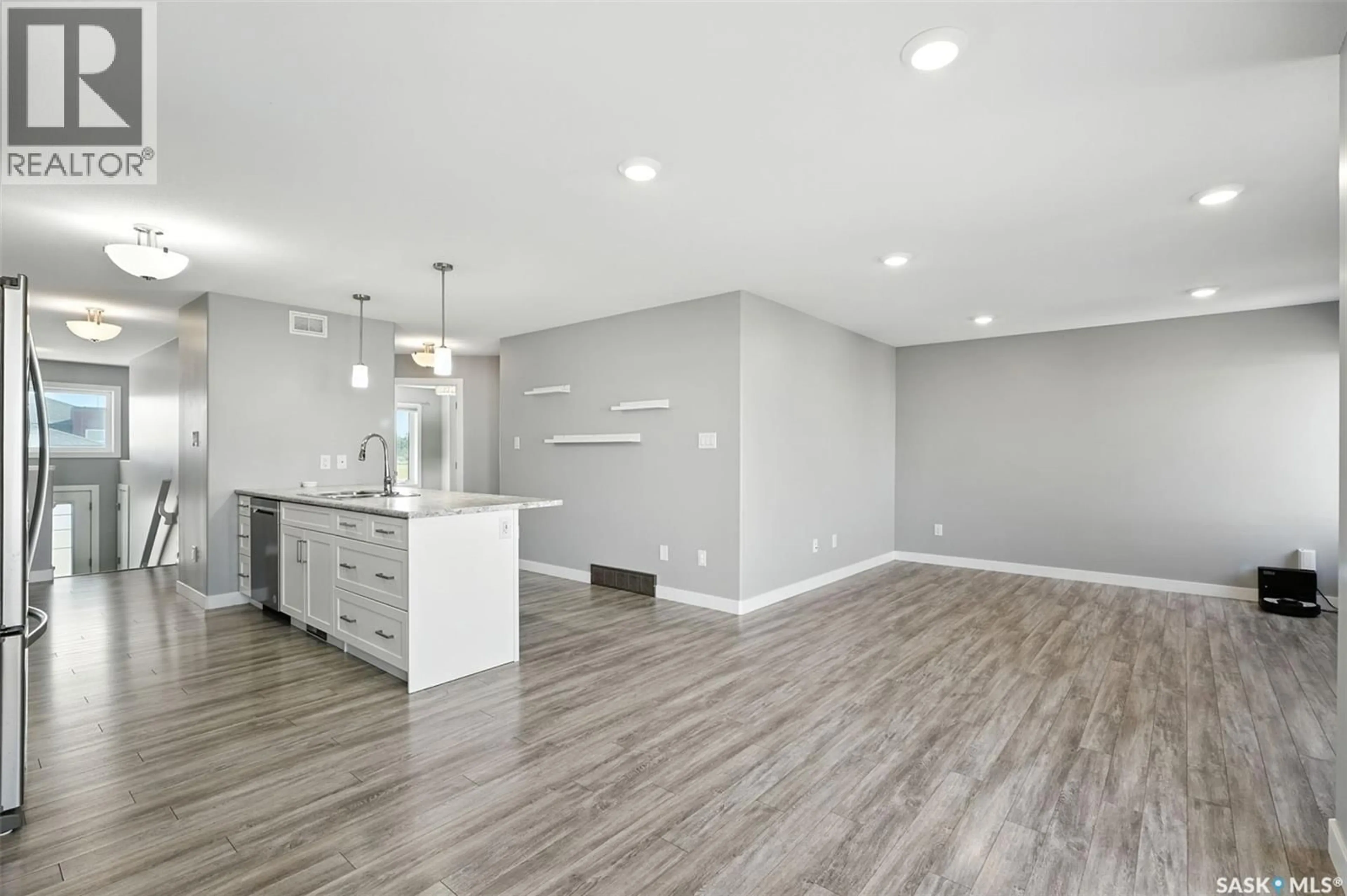 Open concept kitchen, unknown for 220 REDDEKOPP LANE, Warman Saskatchewan S0K4S3