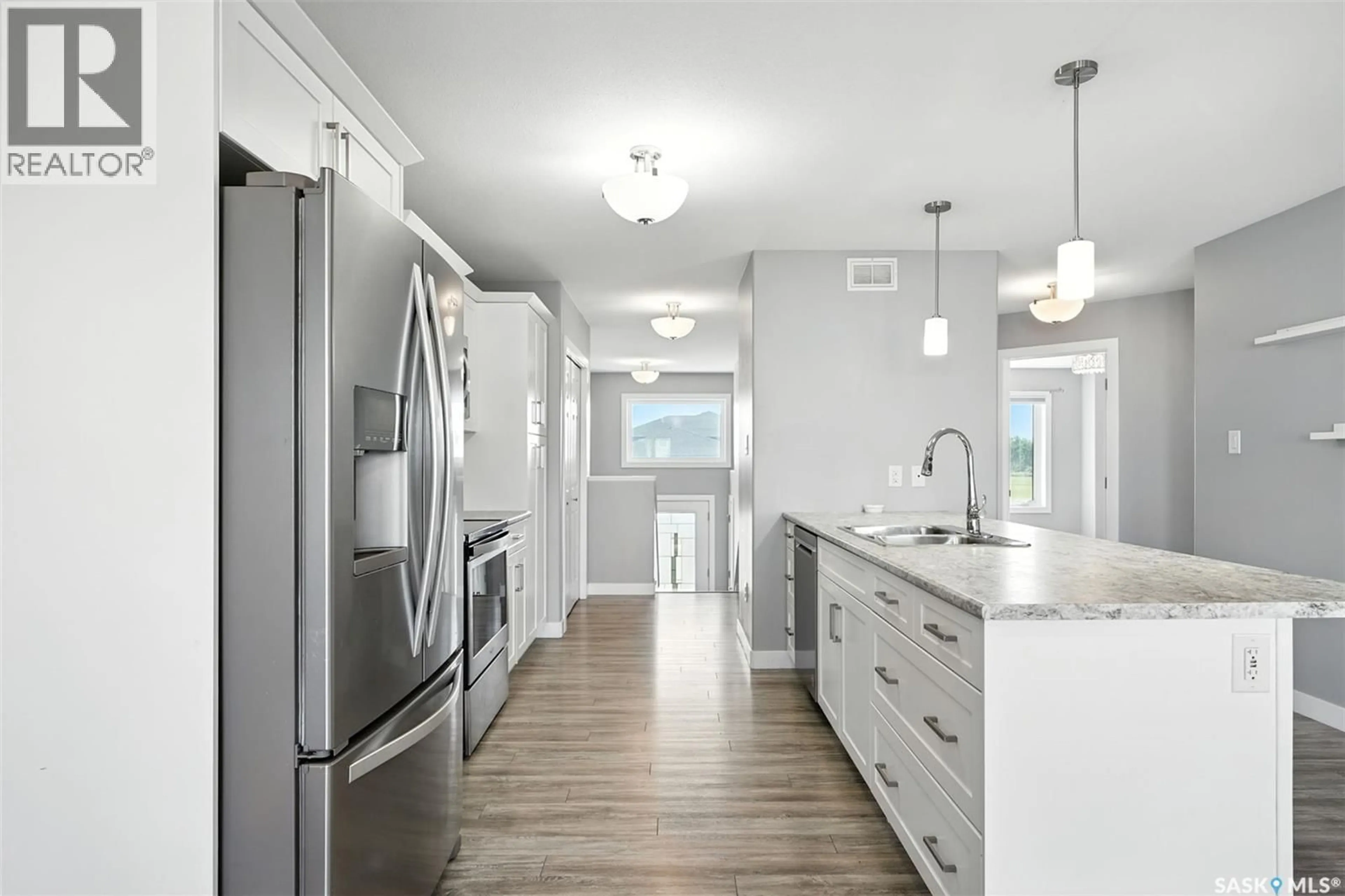 Open concept kitchen, unknown for 220 REDDEKOPP LANE, Warman Saskatchewan S0K4S3