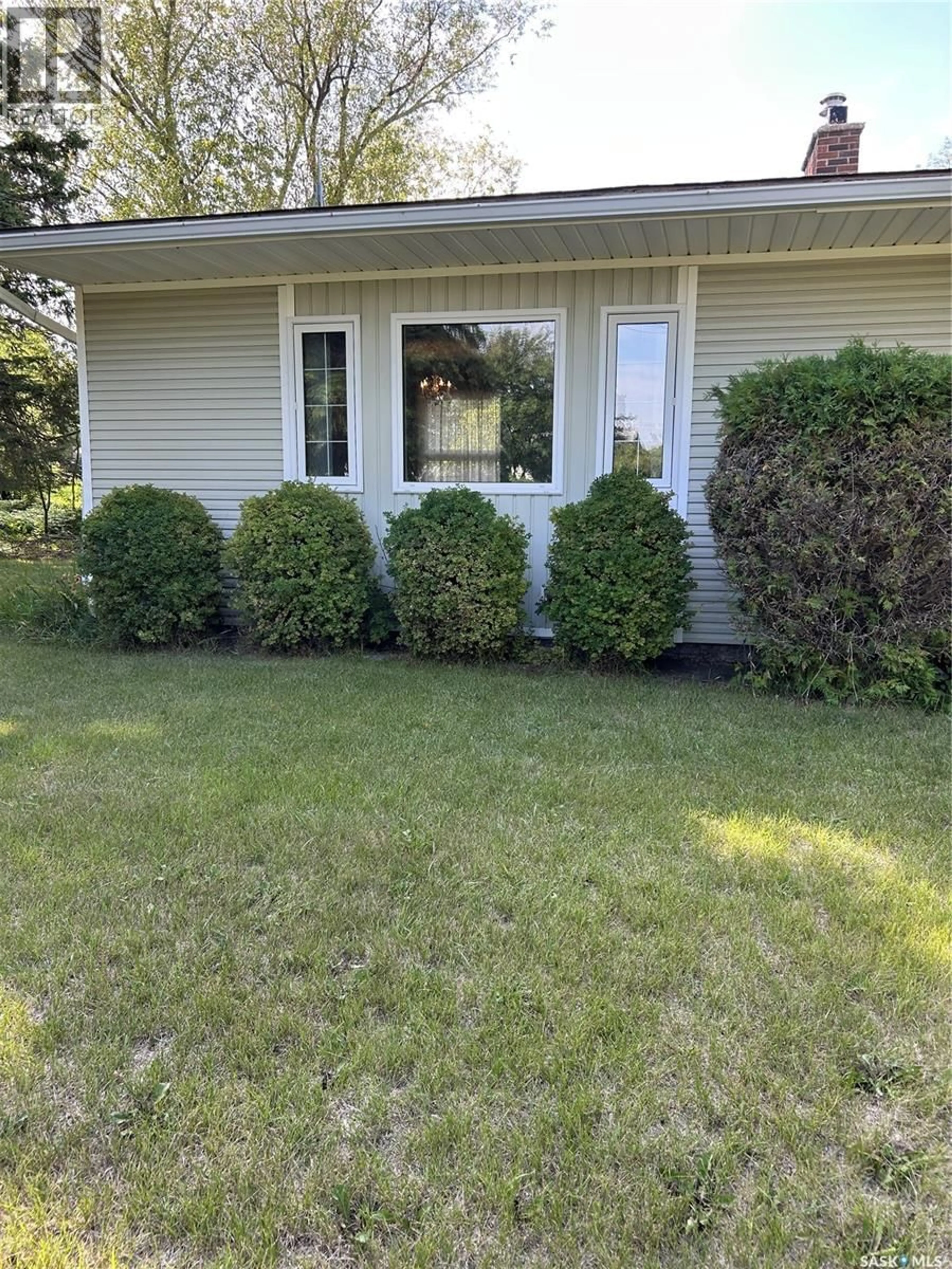 Home with vinyl exterior material, street for 411 1ST STREET, Kelvington Saskatchewan S0A1W0