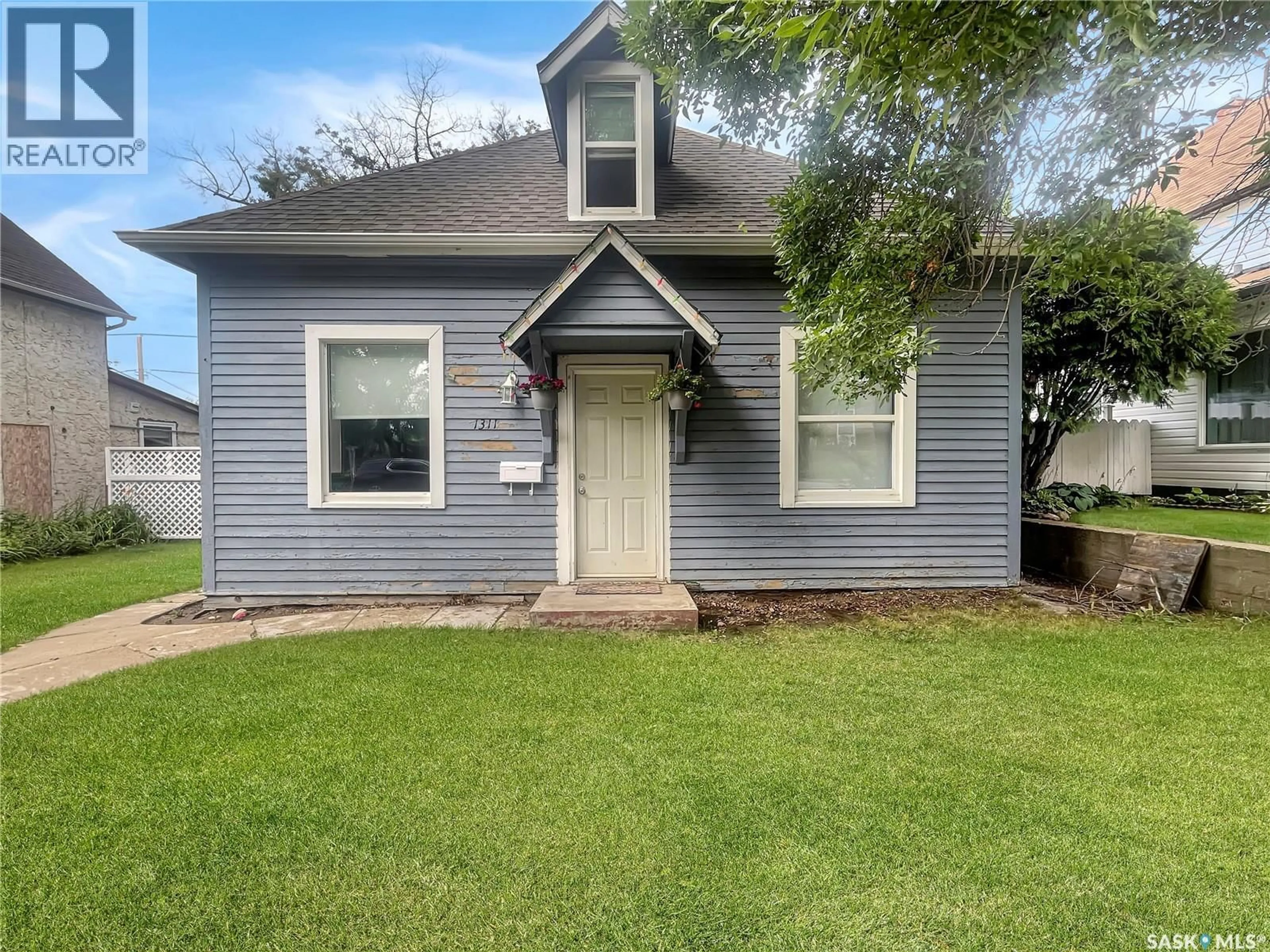 Home with vinyl exterior material, street for 1311 97TH STREET, North Battleford Saskatchewan S9A0J8
