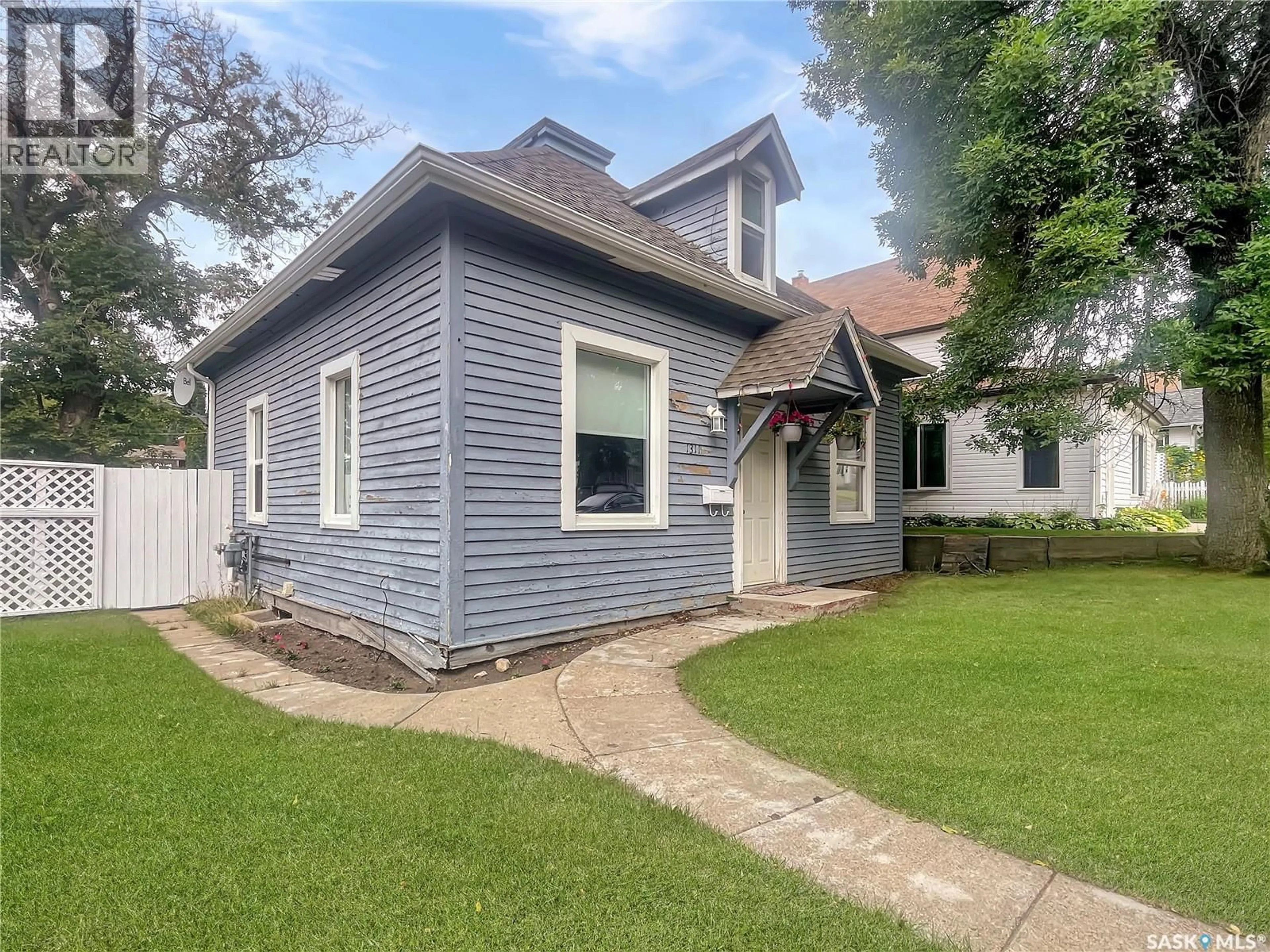Home with vinyl exterior material, street for 1311 97TH STREET, North Battleford Saskatchewan S9A0J8