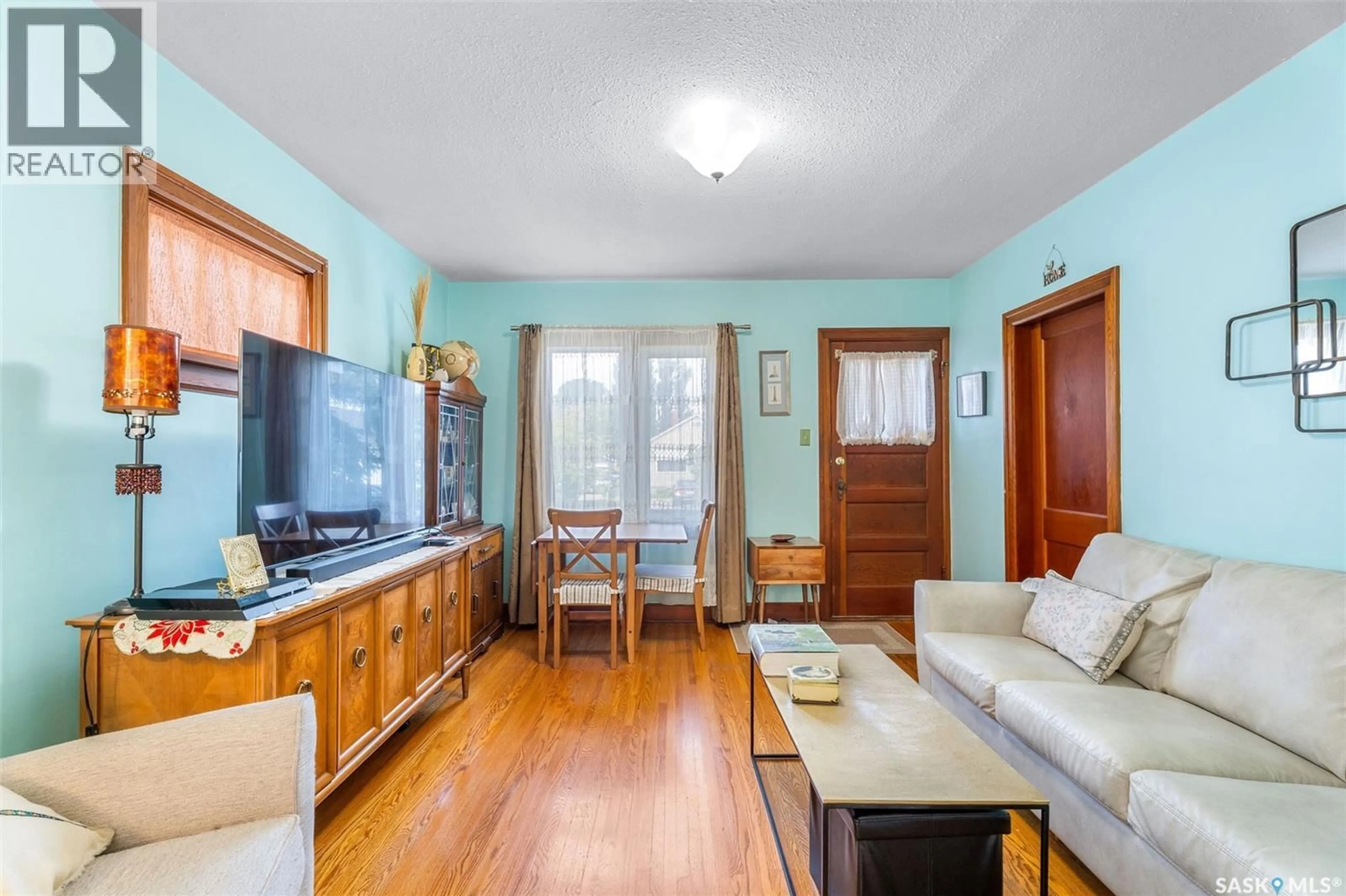 Living room with furniture, wood/laminate floor for 331 11TH STREET, Prince Albert Saskatchewan S6V1A6