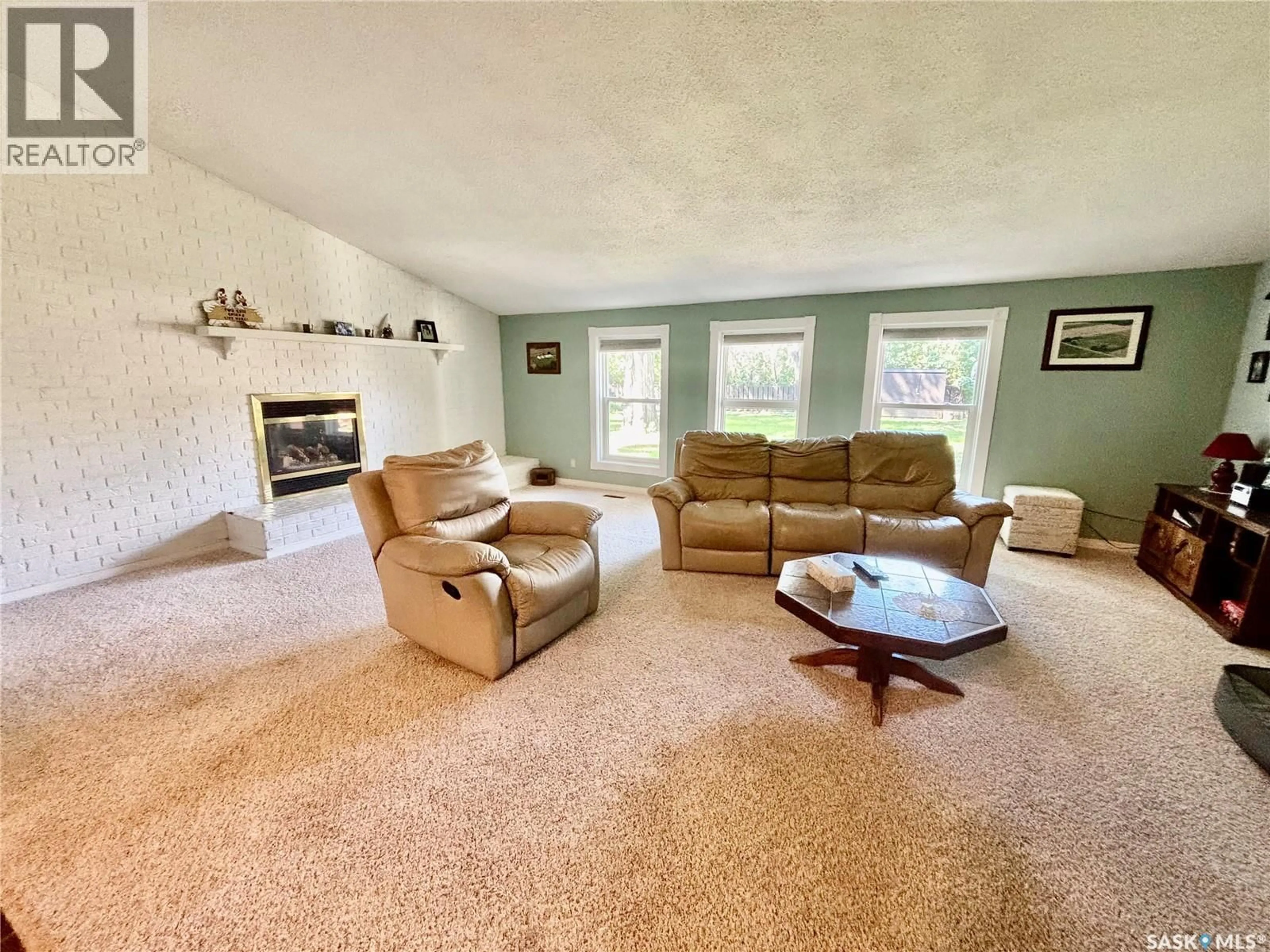 Living room with furniture, carpet floor for 724 4TH STREET, Assiniboia Saskatchewan S0H0B0