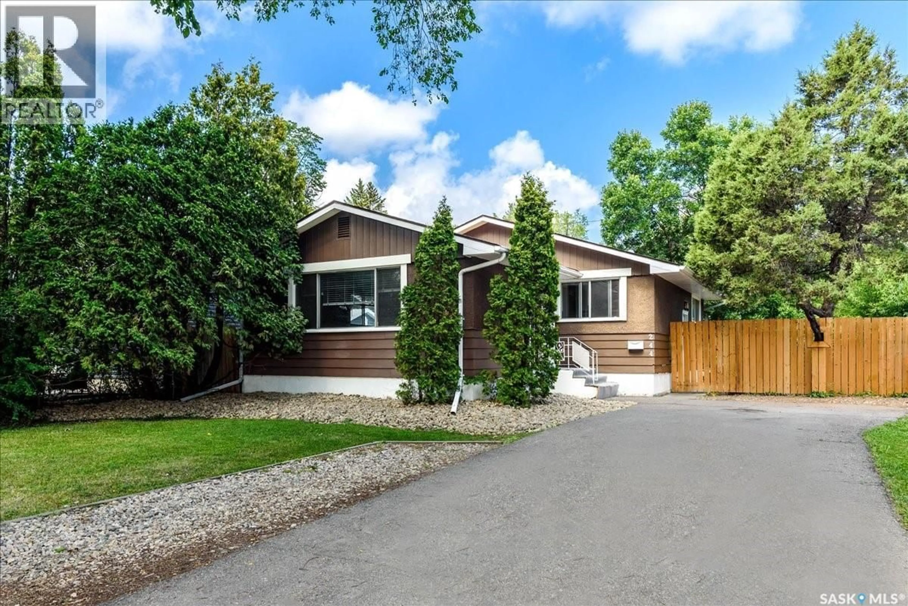 Home with vinyl exterior material, street for 244 LOGAN CRESCENT, Regina Saskatchewan S4S5P9