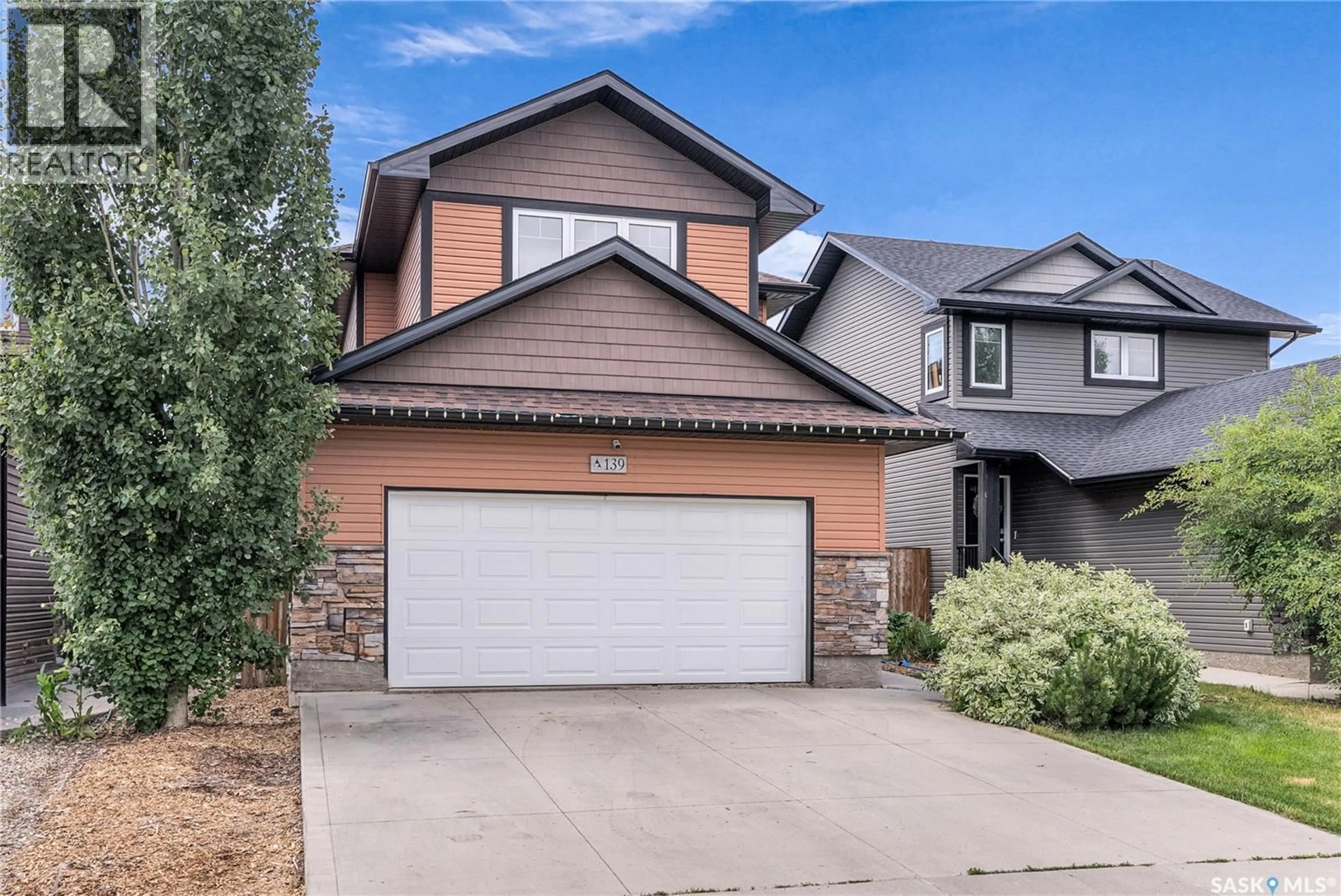 Home with vinyl exterior material, street for 139 CHILDERS CRESCENT, Saskatoon Saskatchewan S7L3G4
