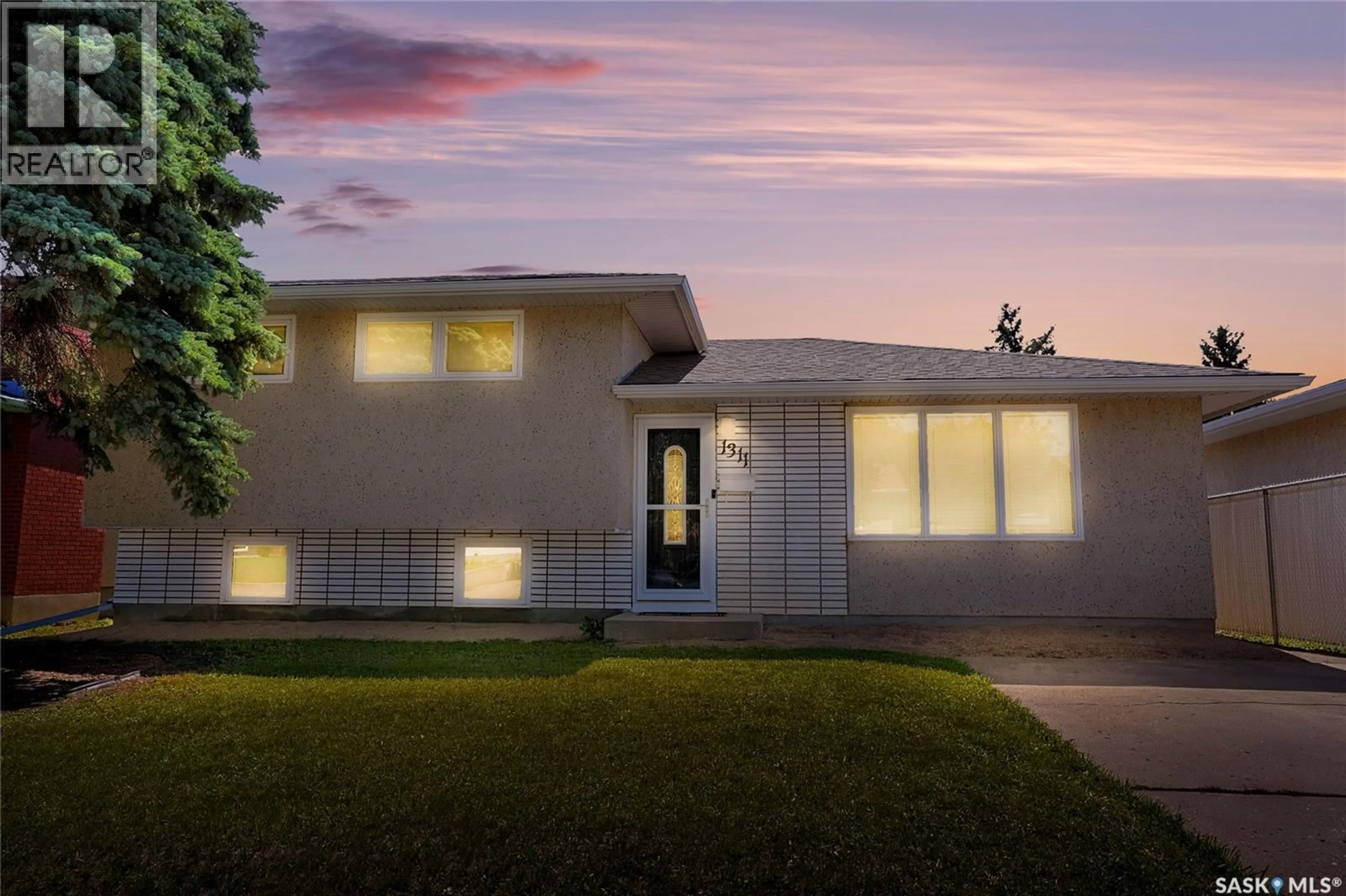 Home with vinyl exterior material, street for 1311 ATHABASCA STREET W, Moose Jaw Saskatchewan S6H6C8