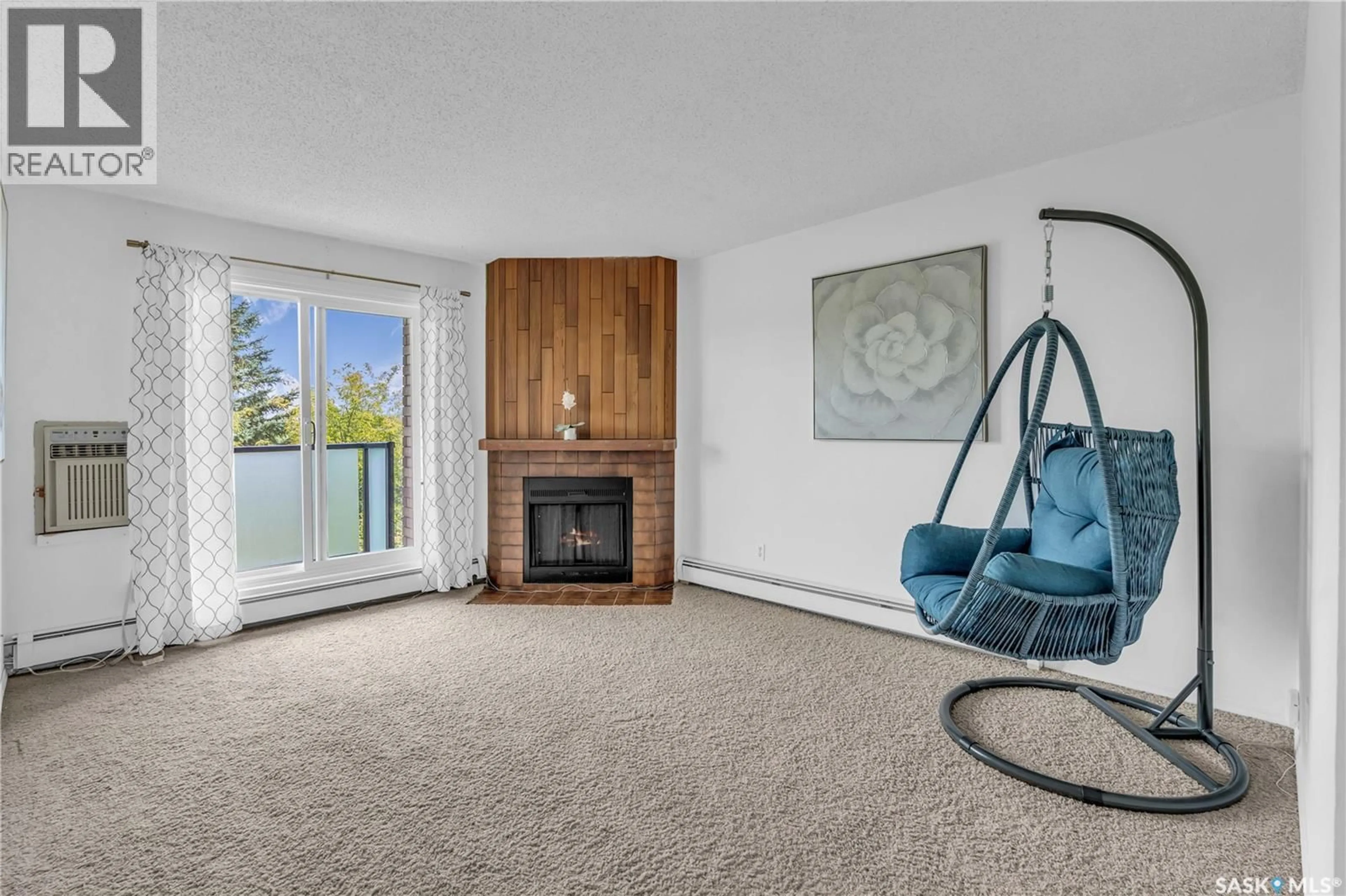 Living room with furniture, carpet floor for 304 411 TAIT COURT, Saskatoon Saskatchewan S7H5L3