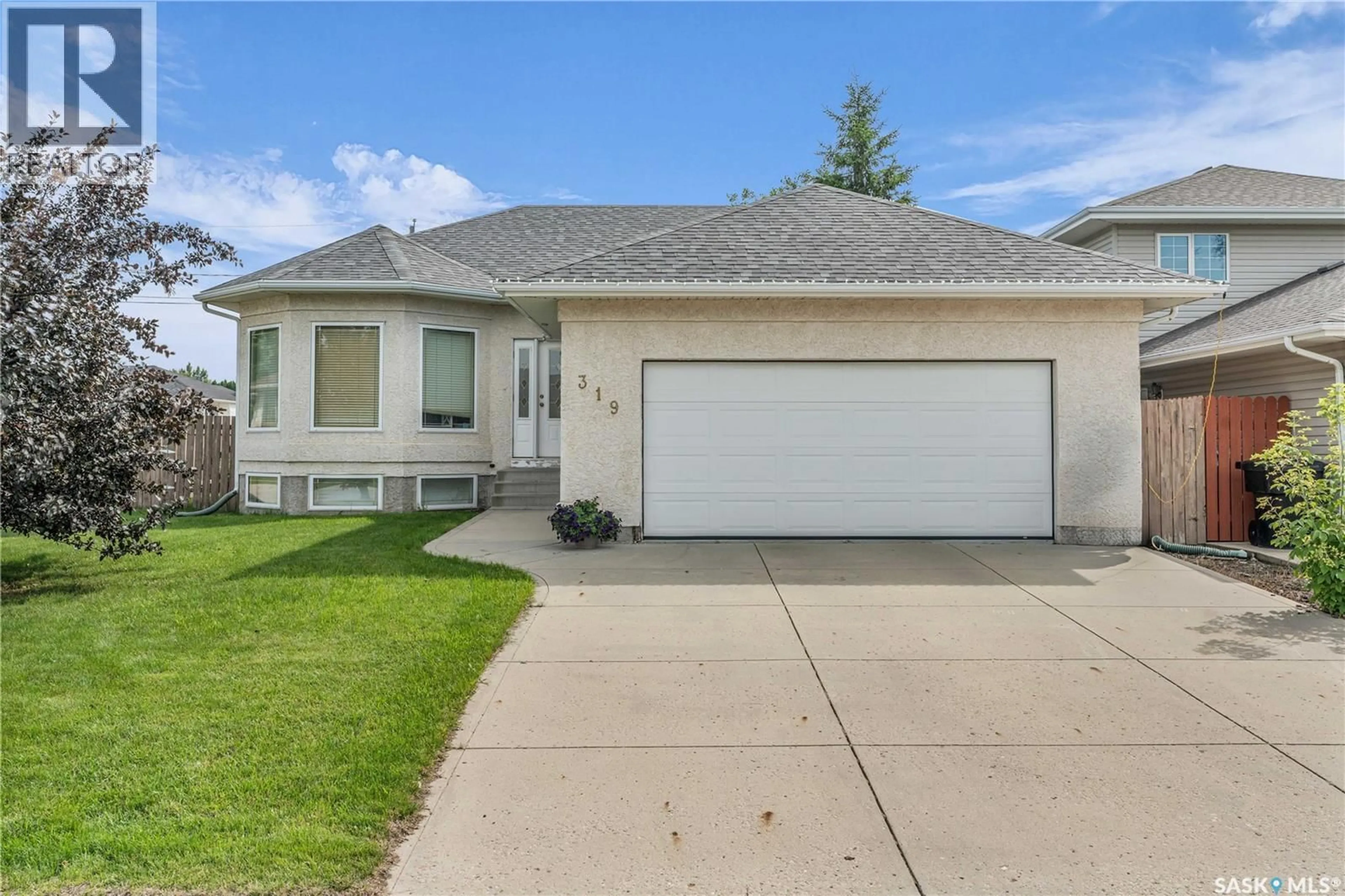 Home with vinyl exterior material, street for 319 3RD AVENUE, Martensville Saskatchewan S0K0A2