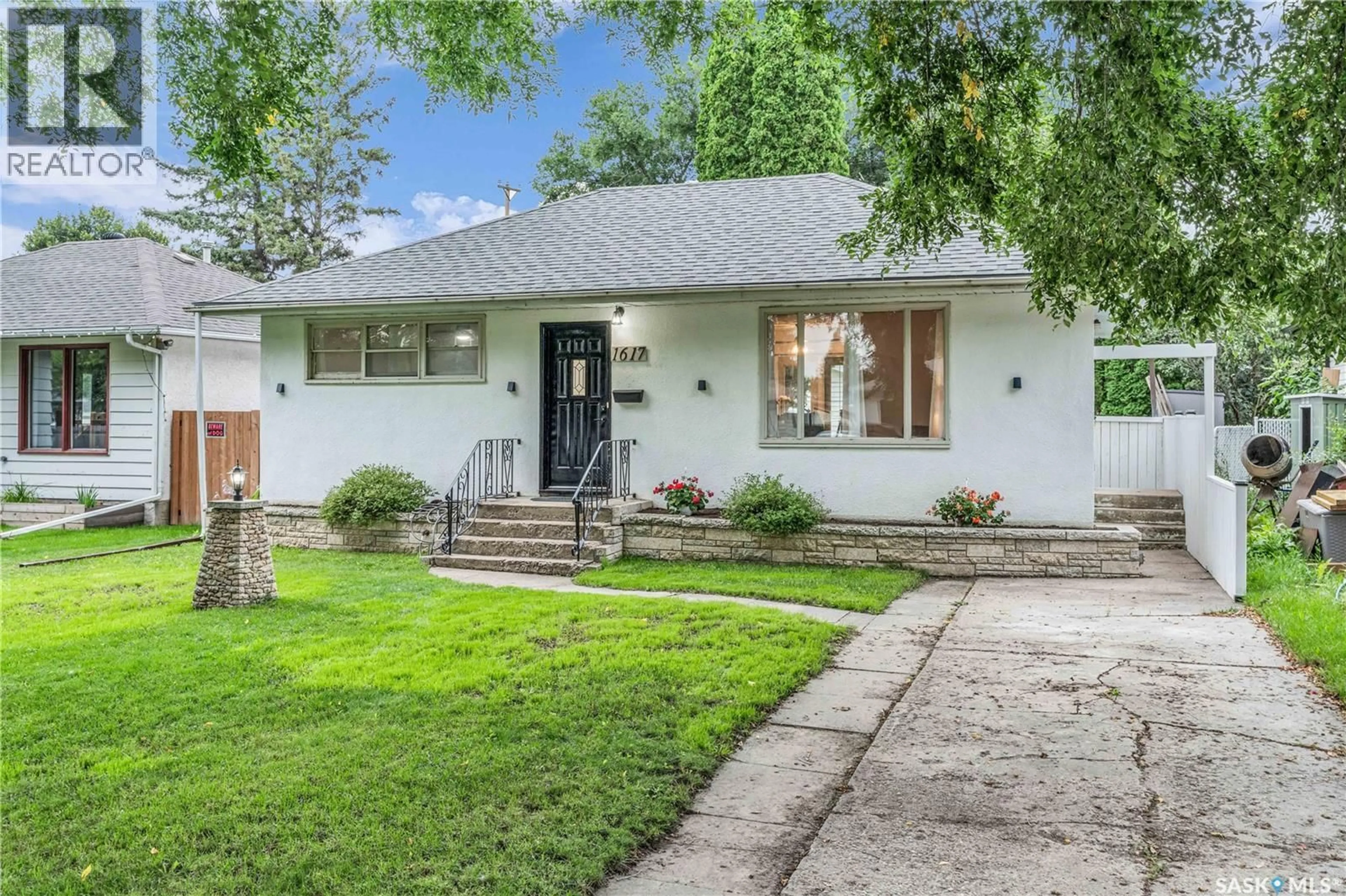 Home with brick exterior material, street for 1617 CAIRNS AVENUE, Saskatoon Saskatchewan S7H2H7