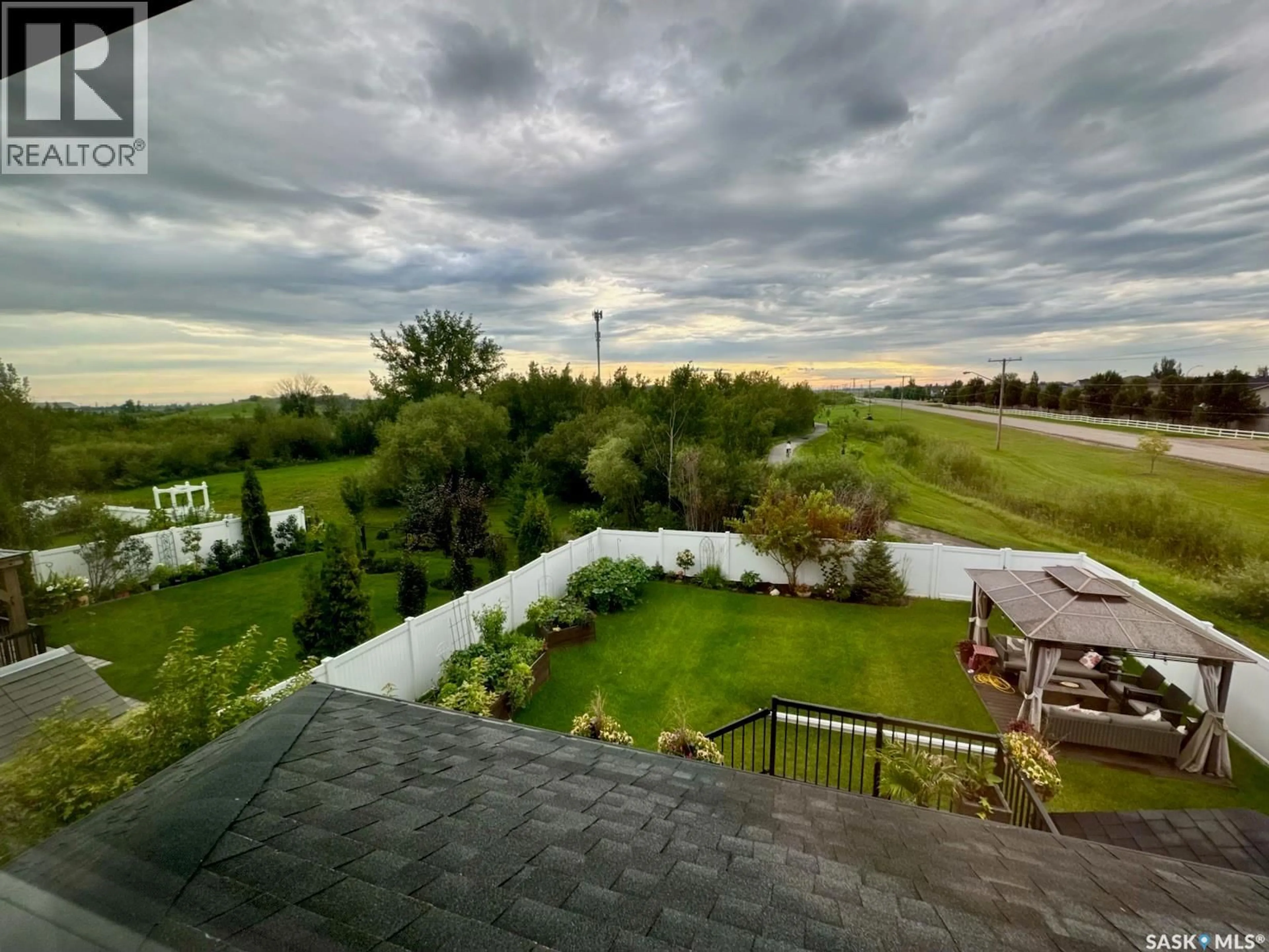 A pic from outside/outdoor area/front of a property/back of a property/a pic from drone, water/lake/river/ocean view for 230 KINSMEN CRESCENT, Martensville Saskatchewan S0K0A2