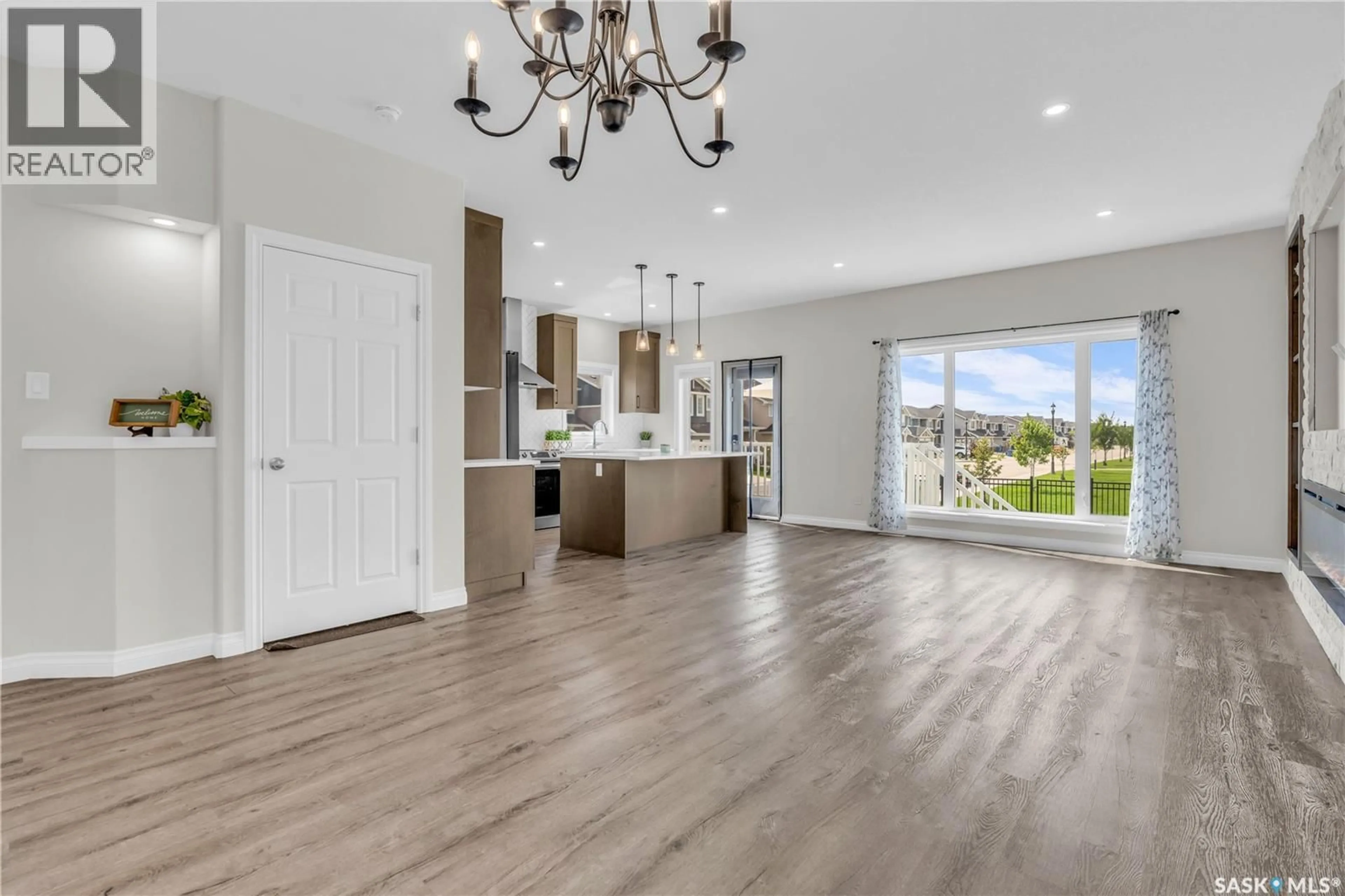 Open concept kitchen, wood/laminate floor for 3160 COPELAND ROAD, Regina Saskatchewan S4V3R9