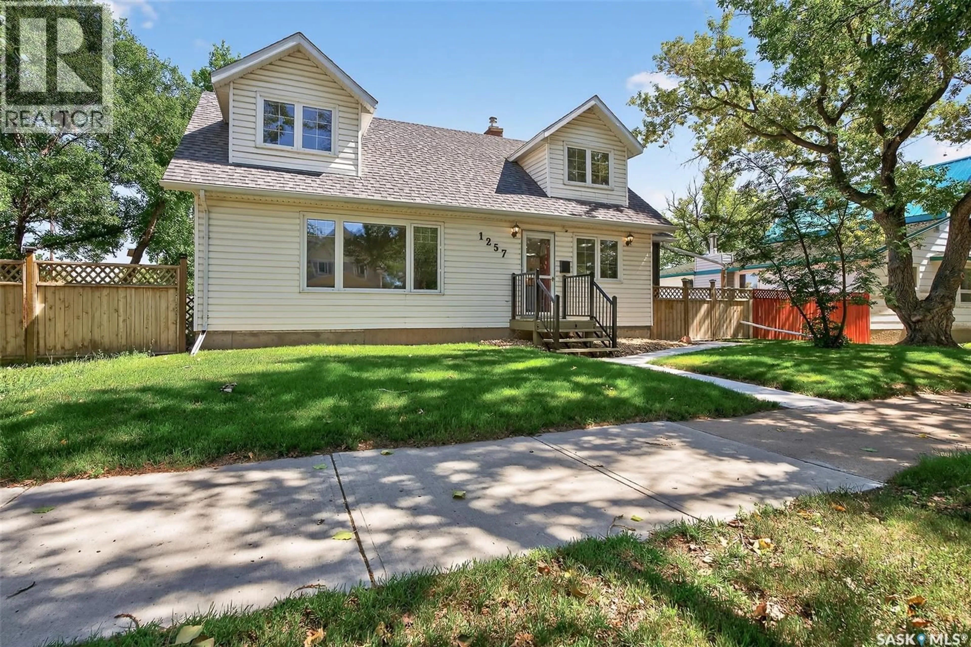 Home with vinyl exterior material, street for 1257 3RD AVENUE, Moose Jaw Saskatchewan S6H1G2