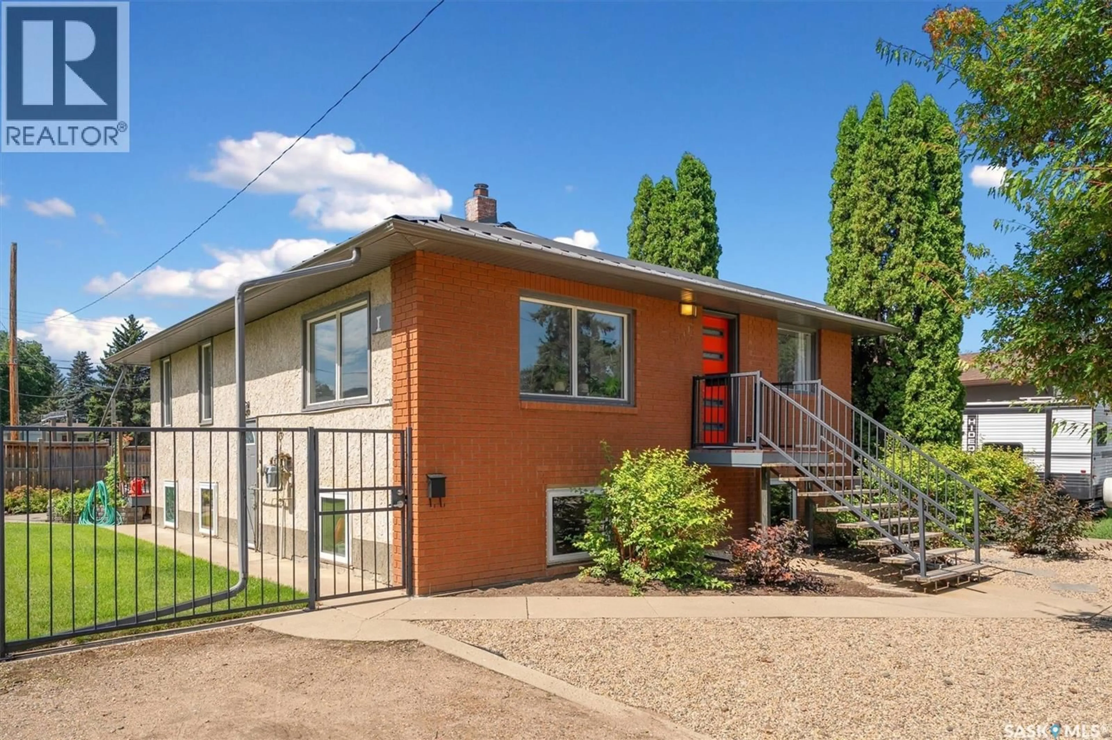 Home with vinyl exterior material, street for 1141 L AVENUE, Saskatoon Saskatchewan S7L2R9