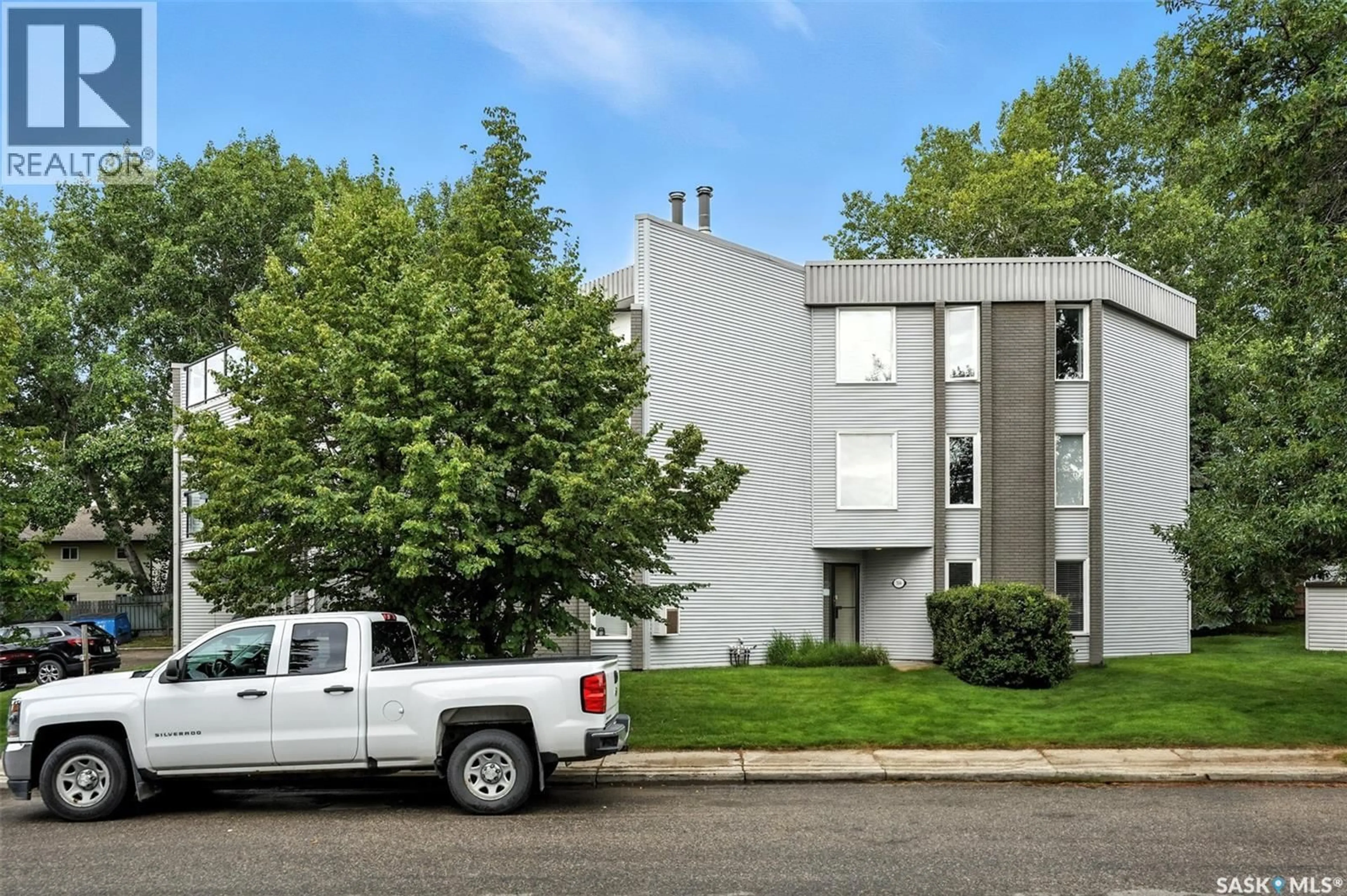 Home with vinyl exterior material, street for 306 - 303 TAIT CRESCENT, Saskatoon Saskatchewan S7H5L2
