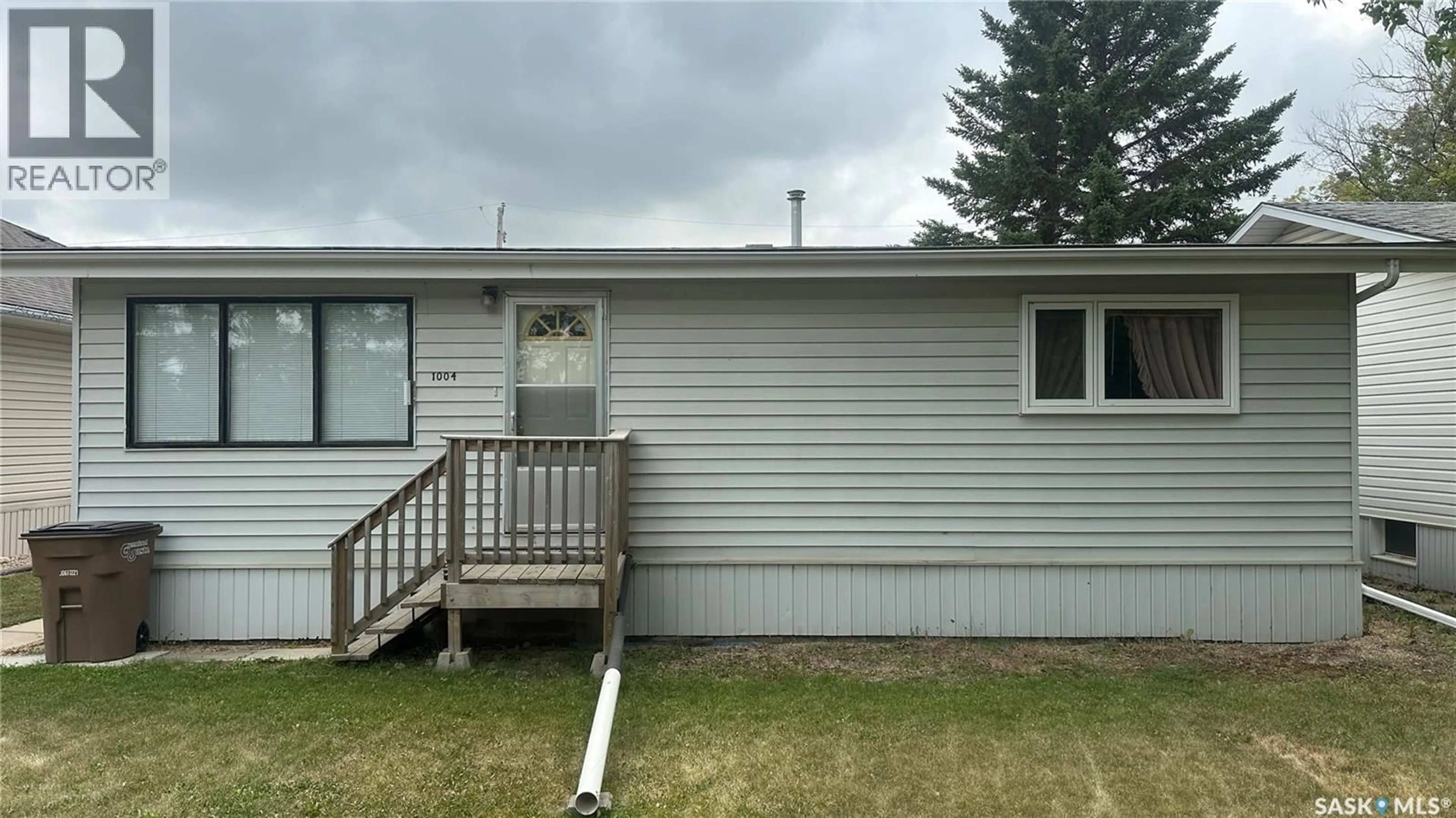 Home with vinyl exterior material, building for 1004 96TH AVENUE, Tisdale Saskatchewan S0E1T0