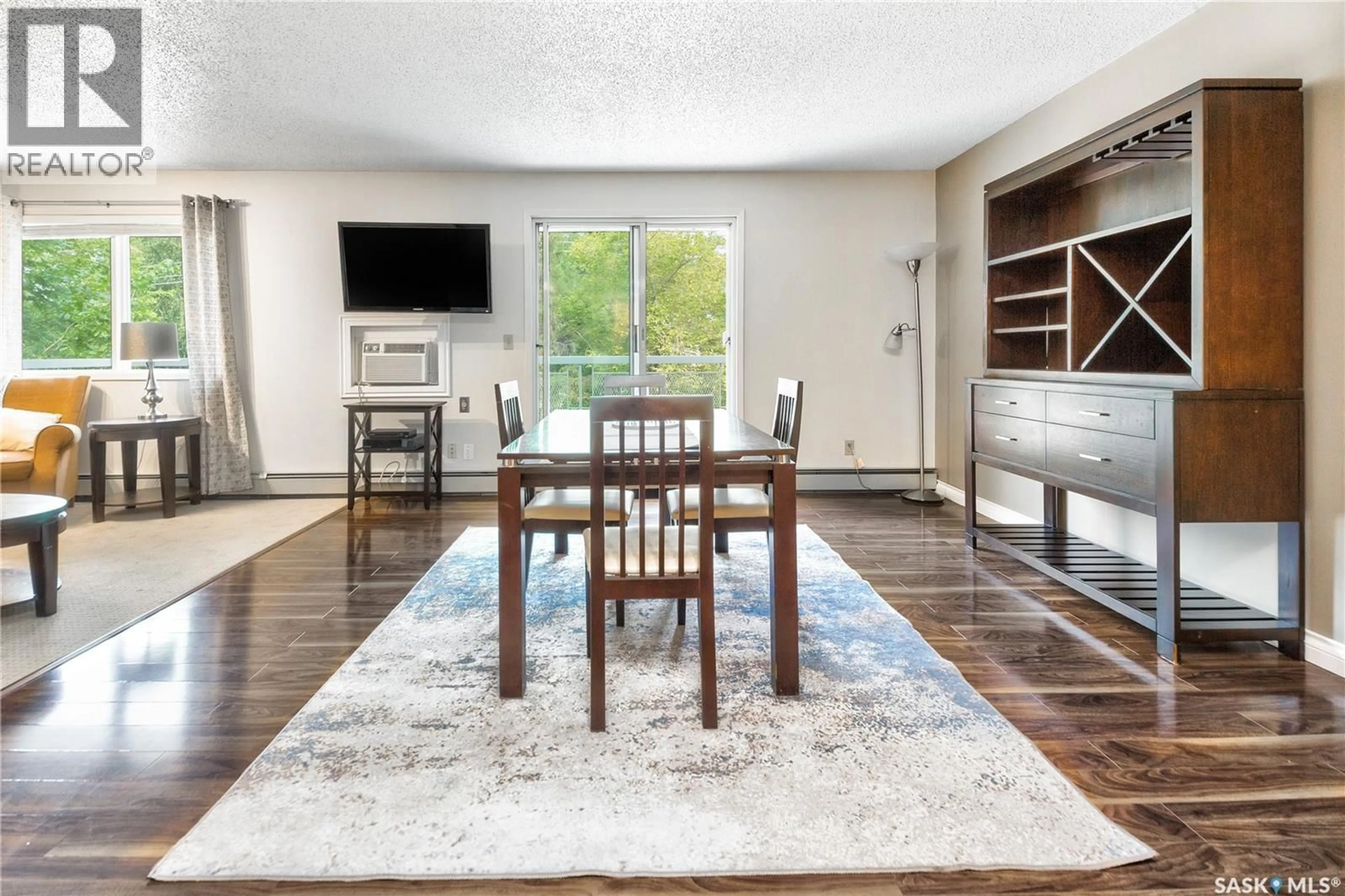 Living room with furniture, wood/laminate floor for 419 - 302 MAIN STREET, Saskatoon Saskatchewan S7N0B9