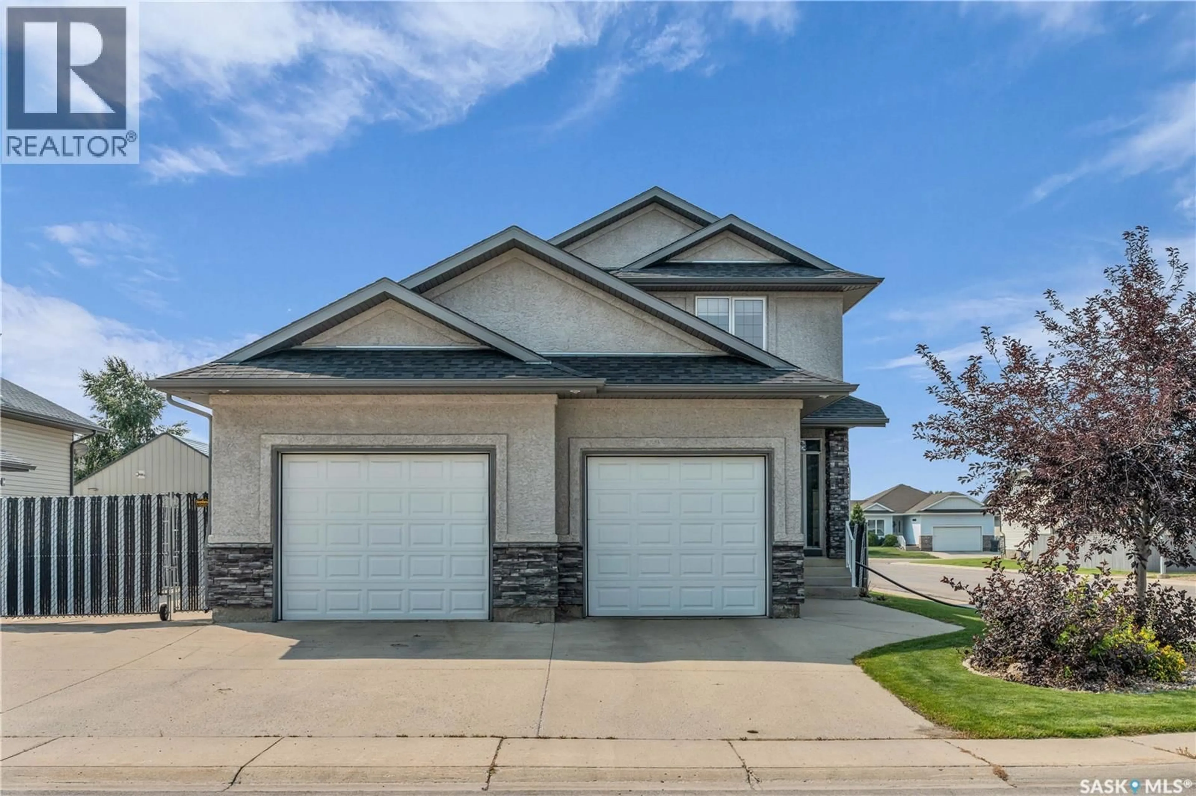 Home with vinyl exterior material, street for 802 ROCK HILL LANE, Martensville Saskatchewan S0K0A2