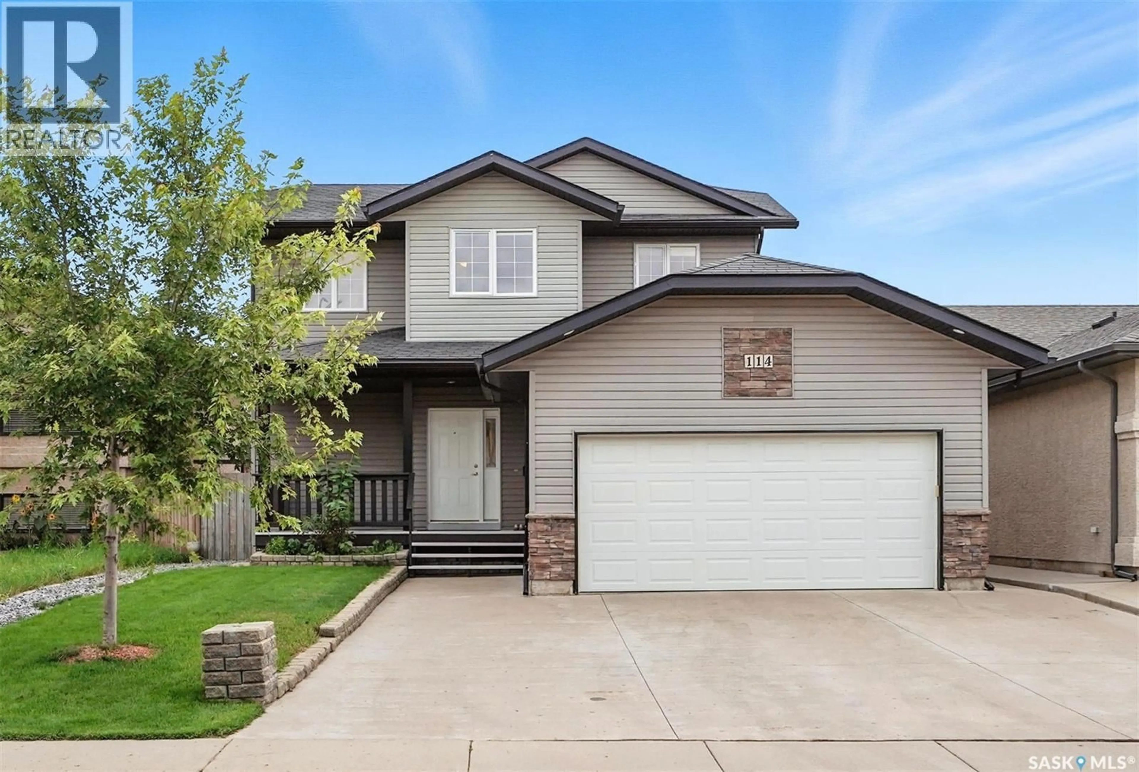 Home with vinyl exterior material, street for 114 LAMARSH ROAD, Saskatoon Saskatchewan S7W1B7