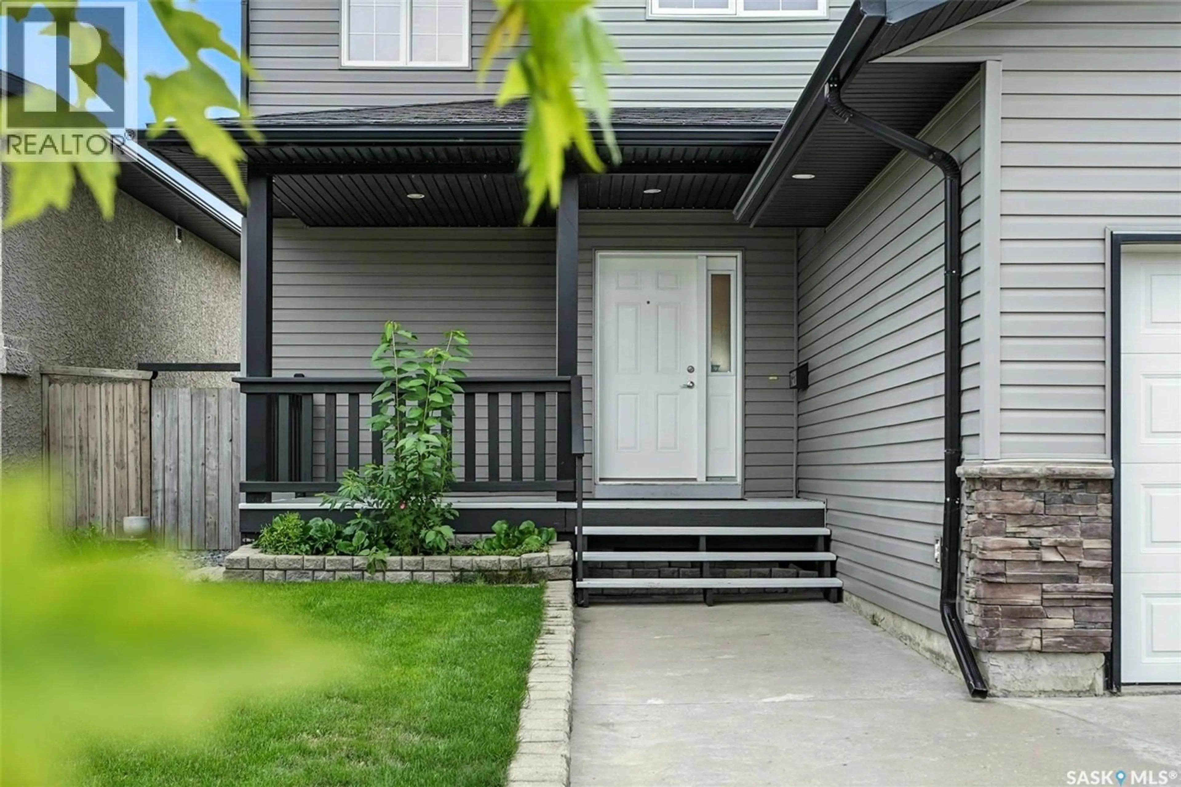 Home with vinyl exterior material, street for 114 LAMARSH ROAD, Saskatoon Saskatchewan S7W1B7