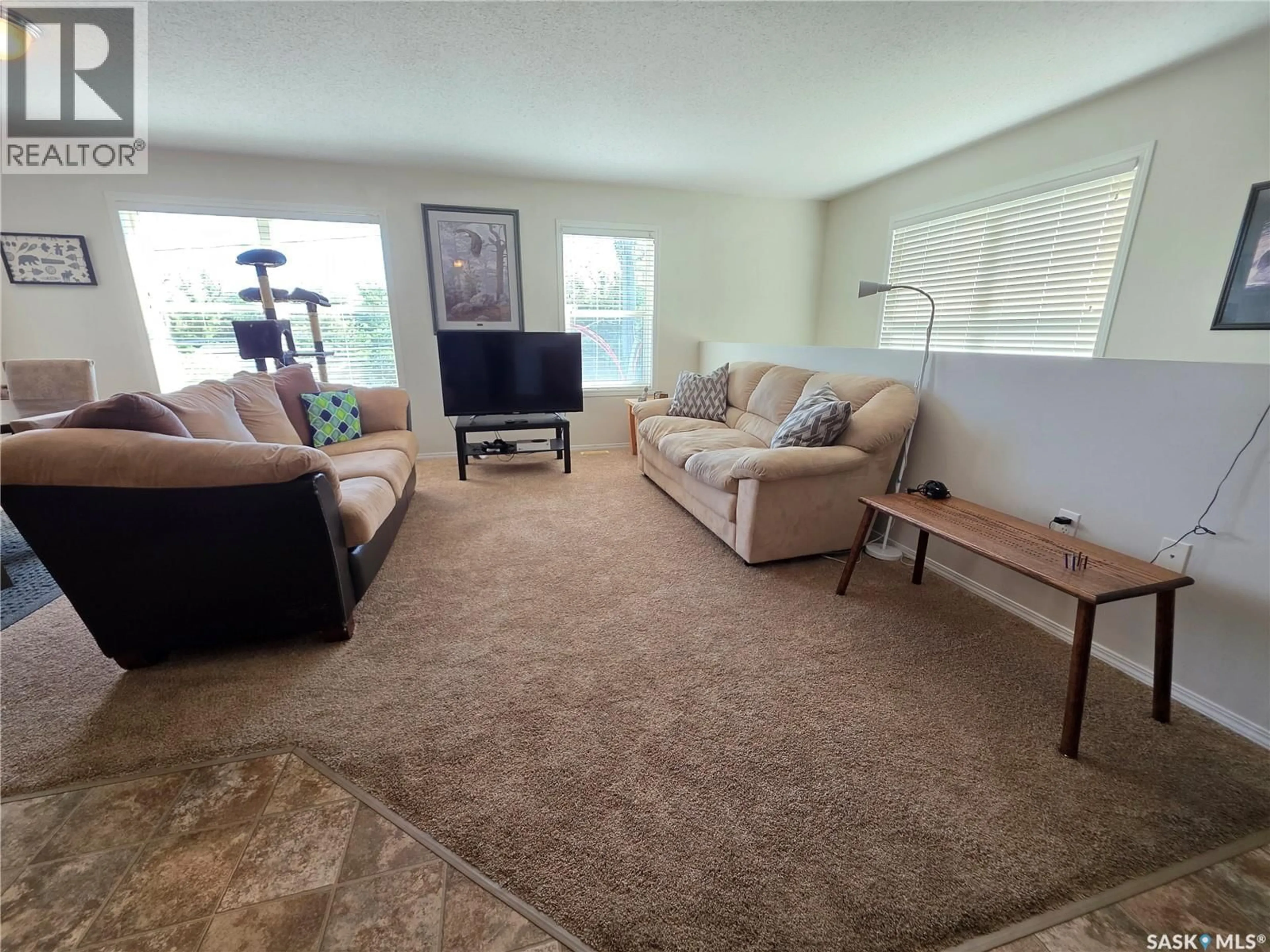 Living room with furniture, carpet floor for E - 22 1275 SOUTH RAILWAY STREET, Swift Current Saskatchewan S9H5P3