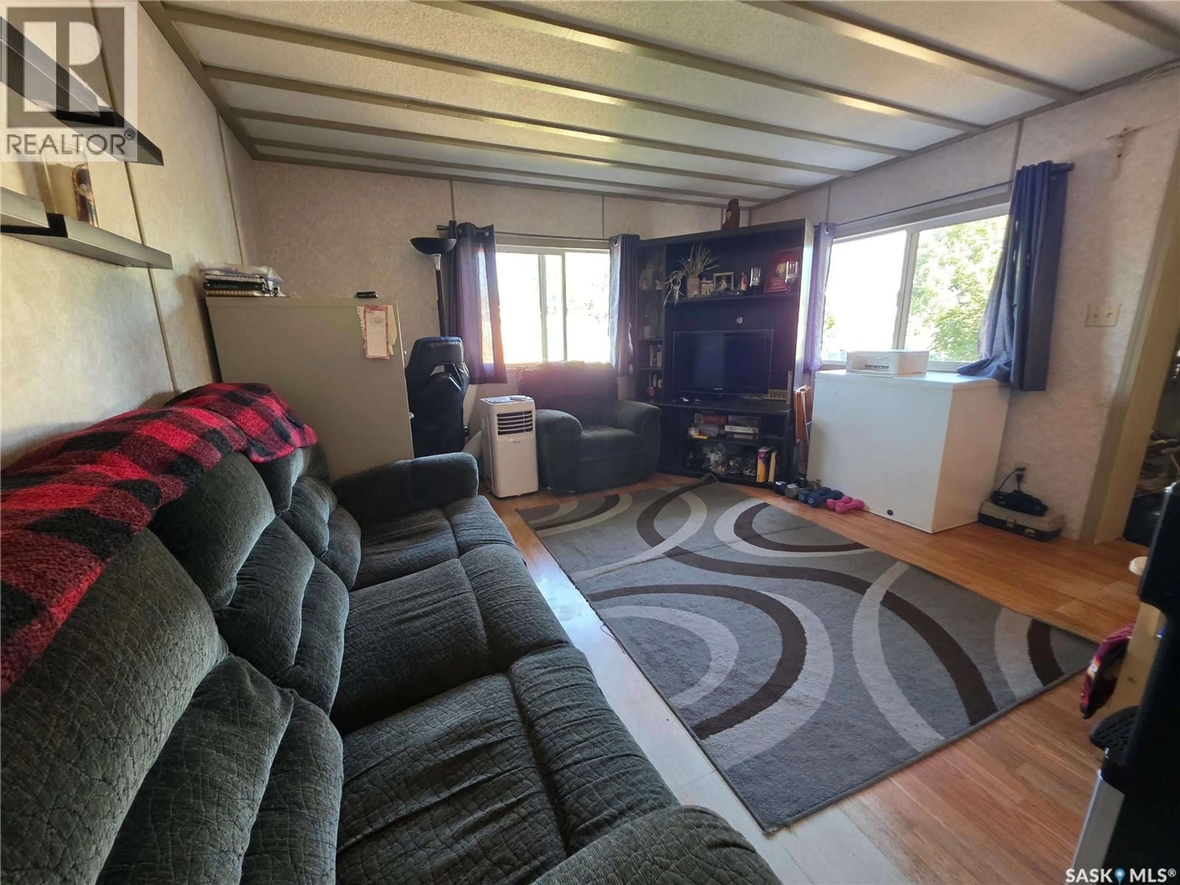 Living room with furniture, unknown for 4 PRAIRIE SUN COURT, Swift Current Saskatchewan S9H3X6