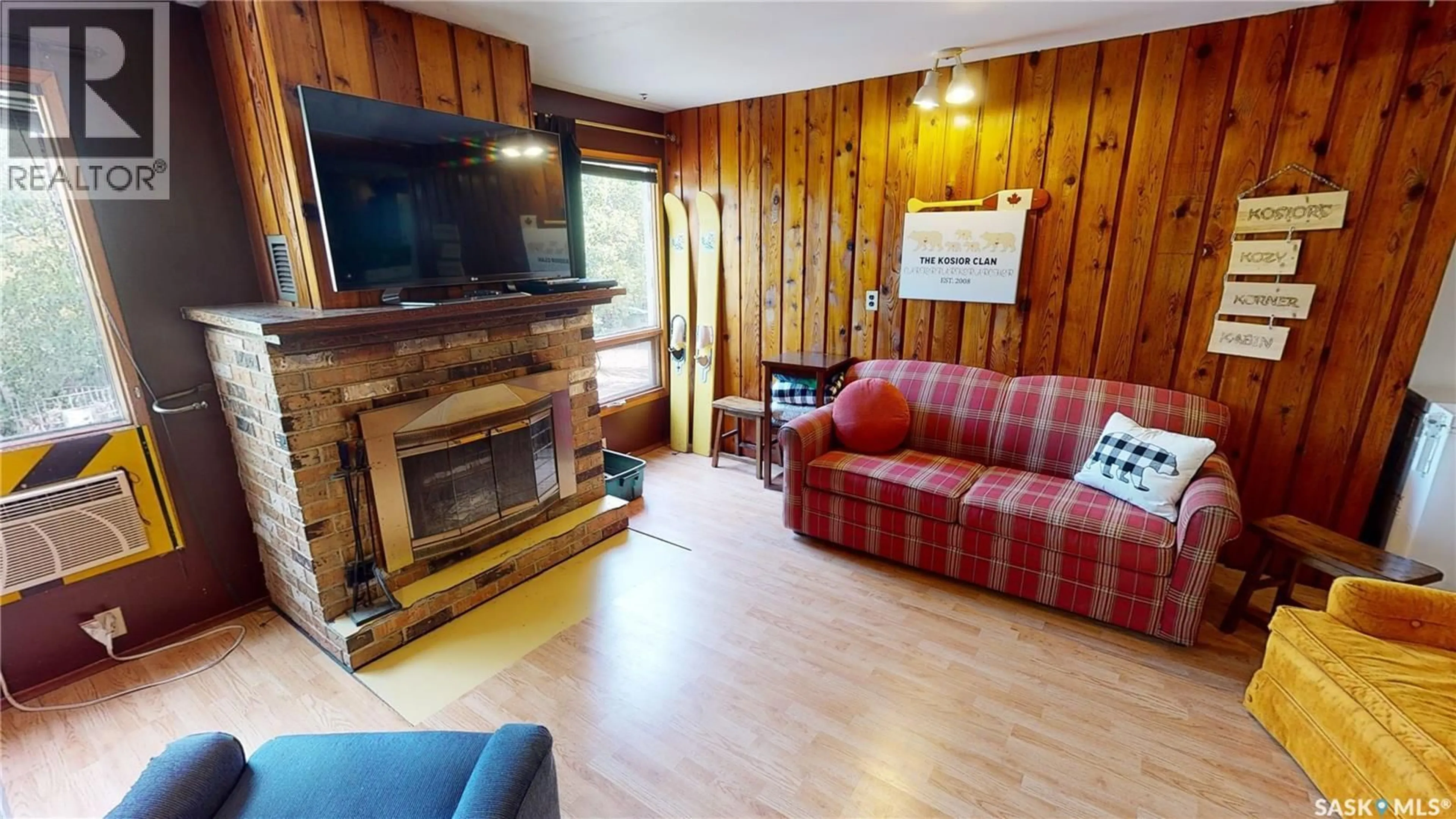 Living room with furniture, wood/laminate floor for 721 9TH STREET, White Bear IR 70 Saskatchewan S0C2S0