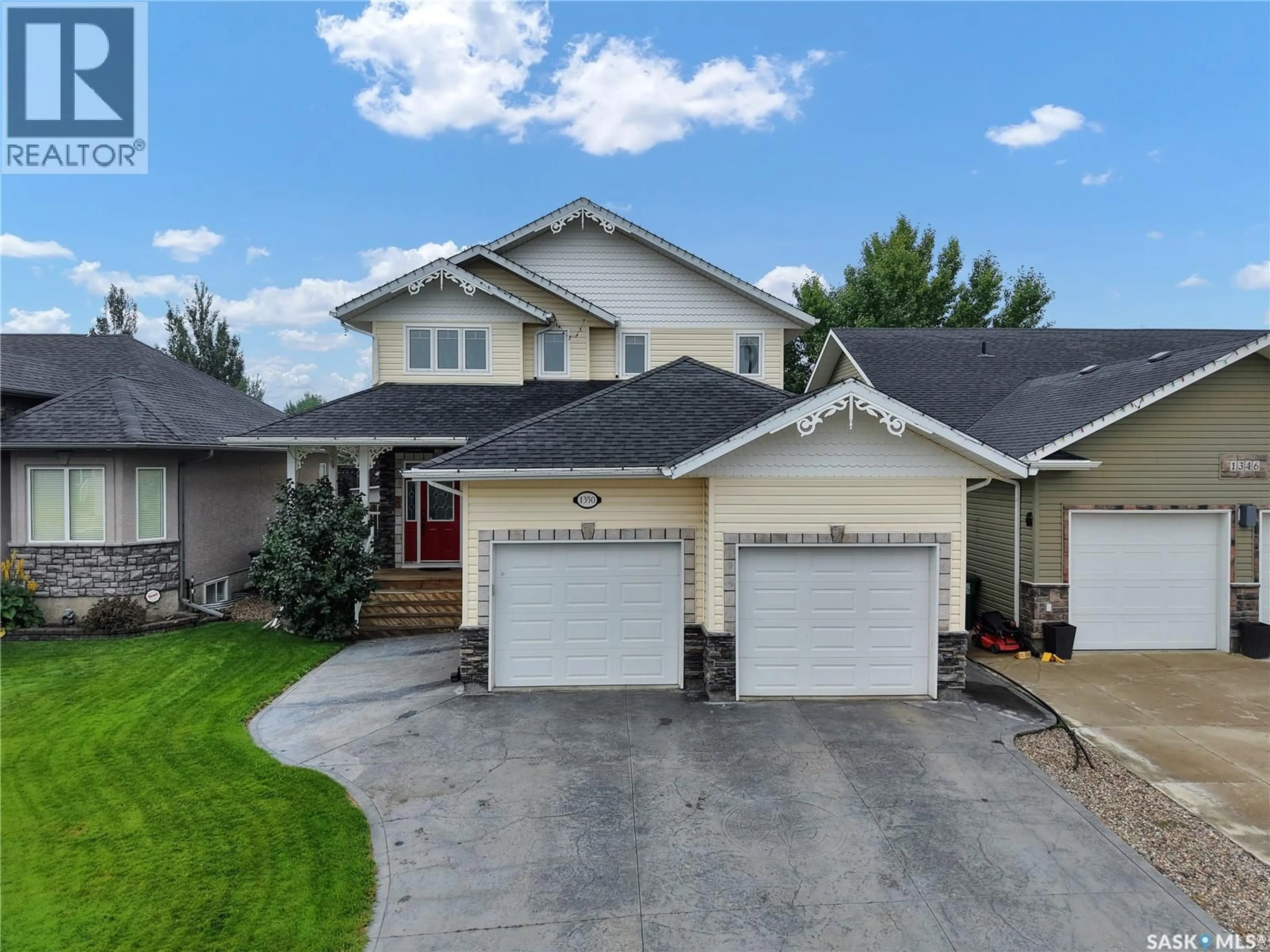 Home with vinyl exterior material, street for 1350 WILLOWGROVE TERRACE, Saskatoon Saskatchewan S7W0A9