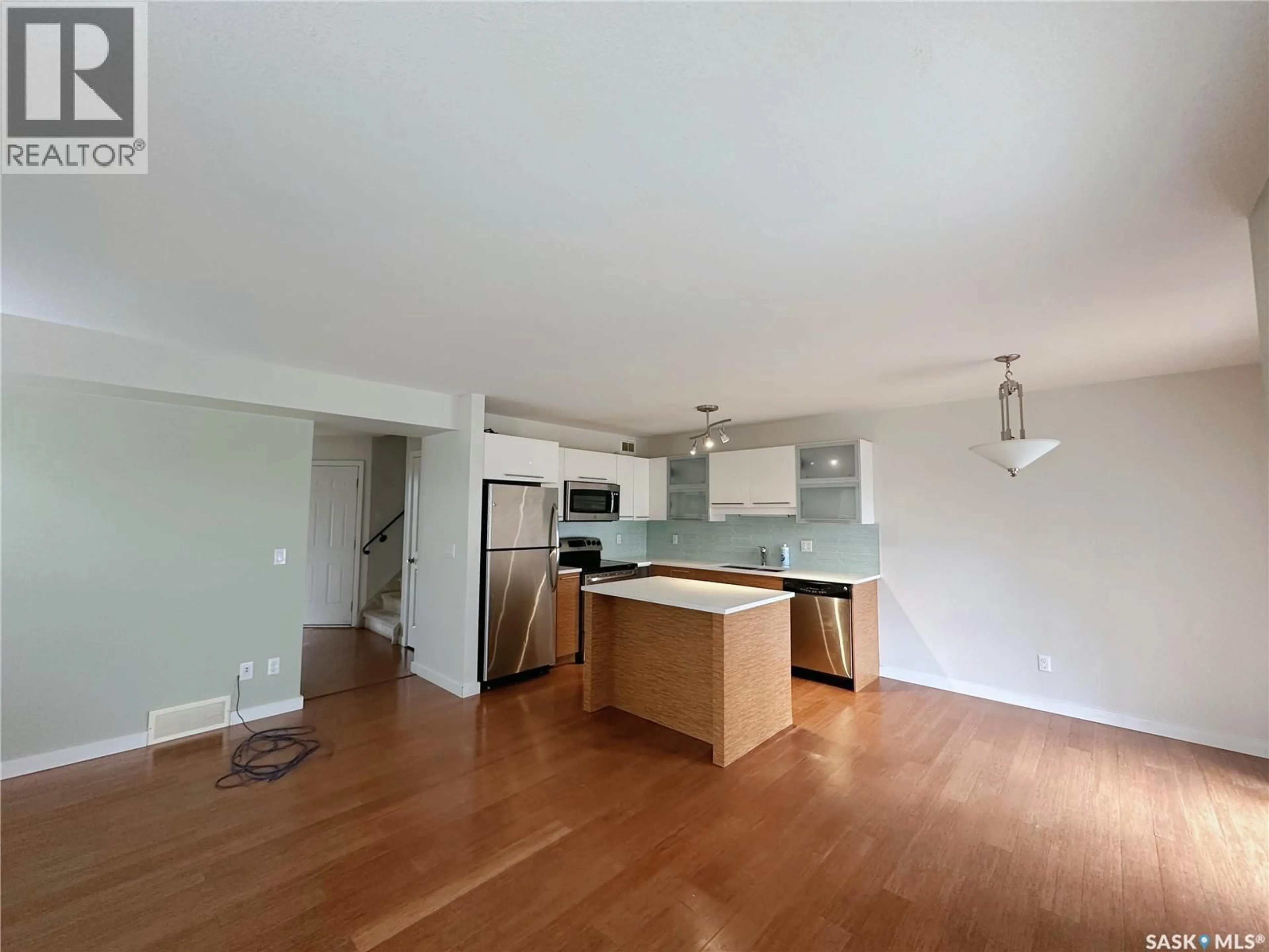 Open concept kitchen, wood/laminate floor for 301 410 HUNTER ROAD, Saskatoon Saskatchewan S7T0L5