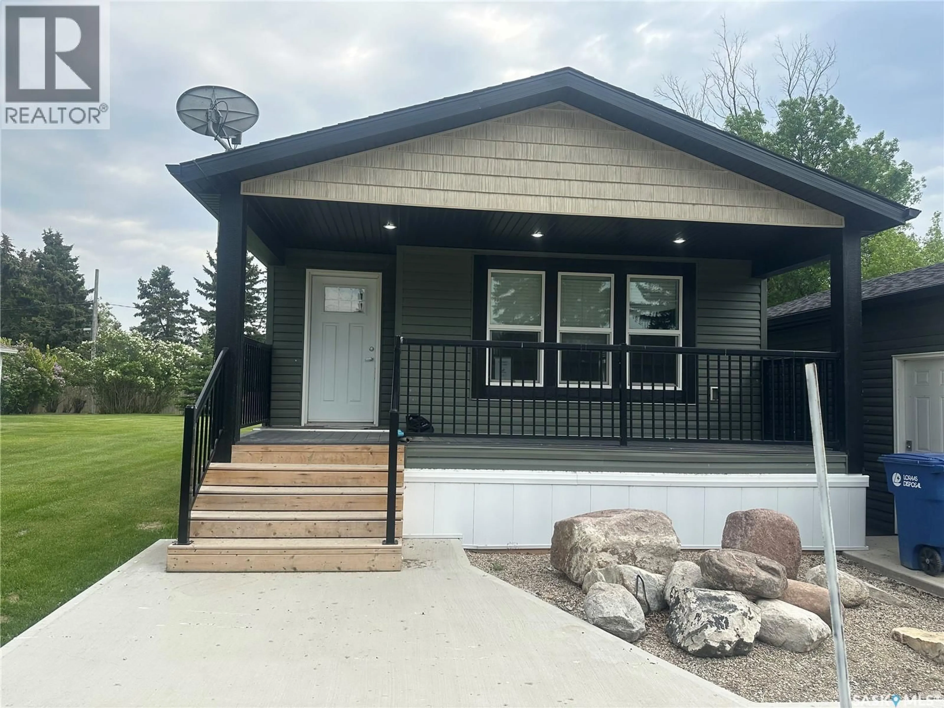 Home with vinyl exterior material, street for 209 2ND AVENUE, Kendal Saskatchewan S0G2P0