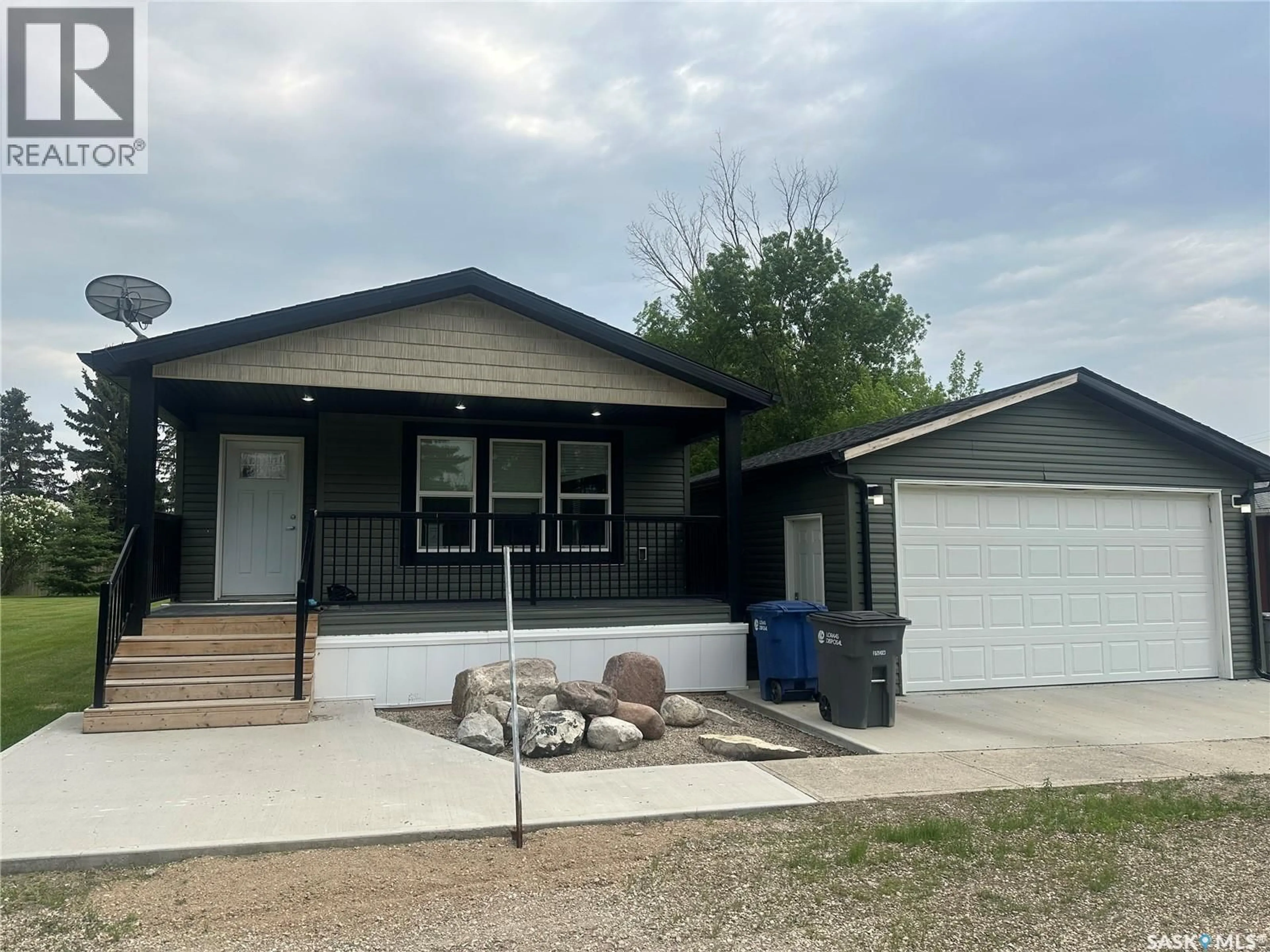 Home with vinyl exterior material, street for 209 2ND AVENUE, Kendal Saskatchewan S0G2P0